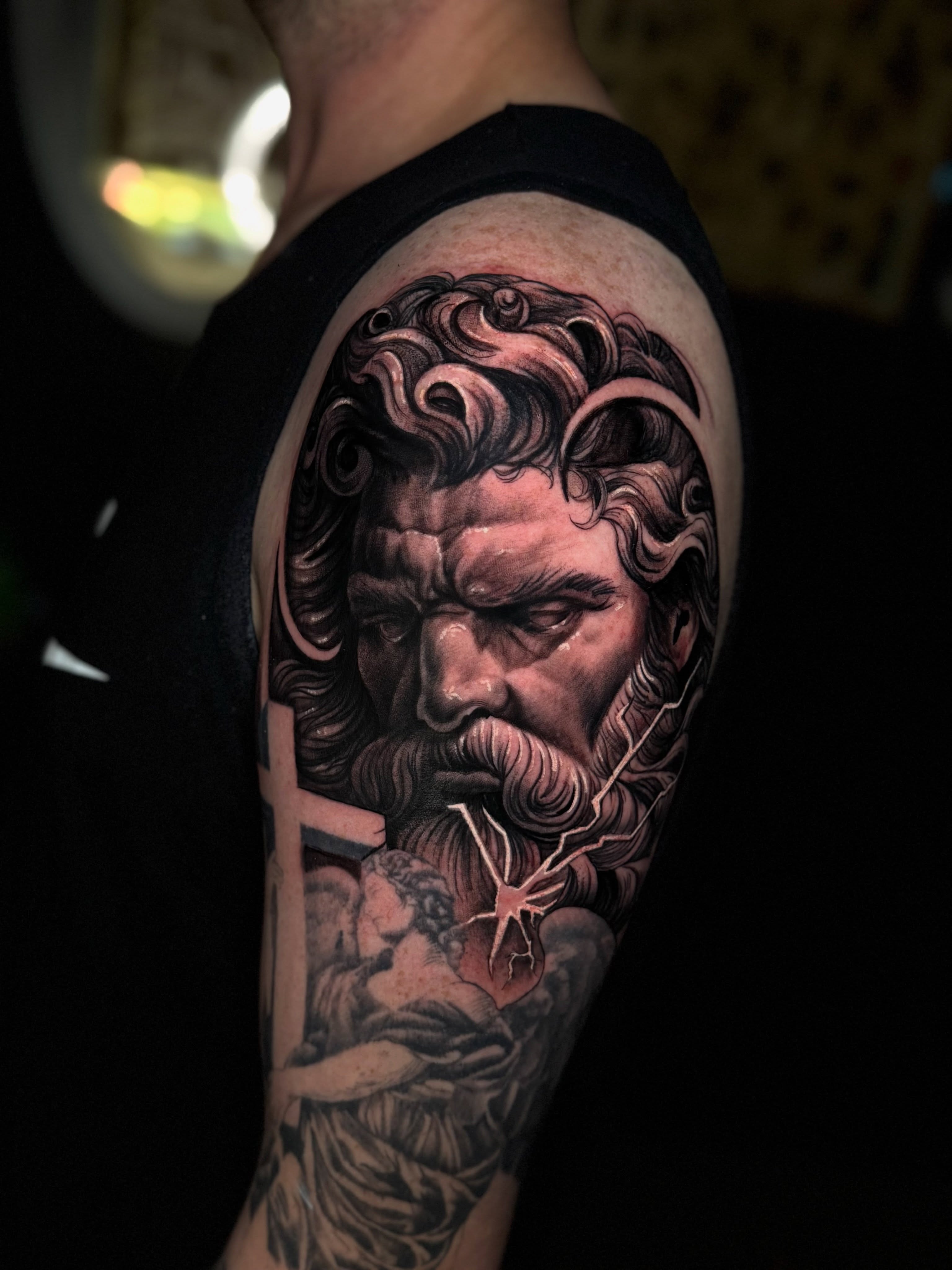 God-like figure realism tattoo on the shoulder by Christian Hood