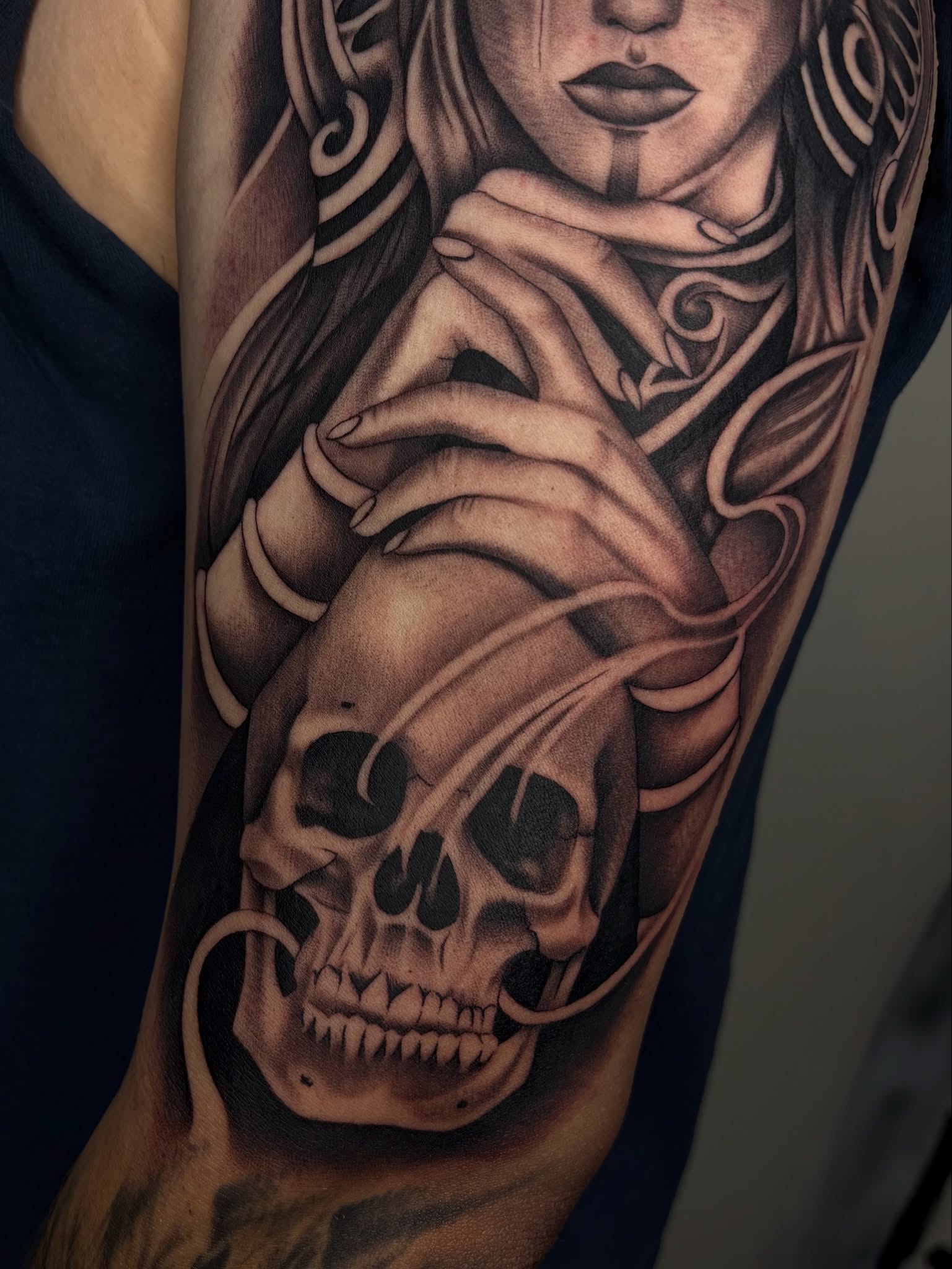 Woman with skull realism tattoo on the forearm by Osiel Rodriguez