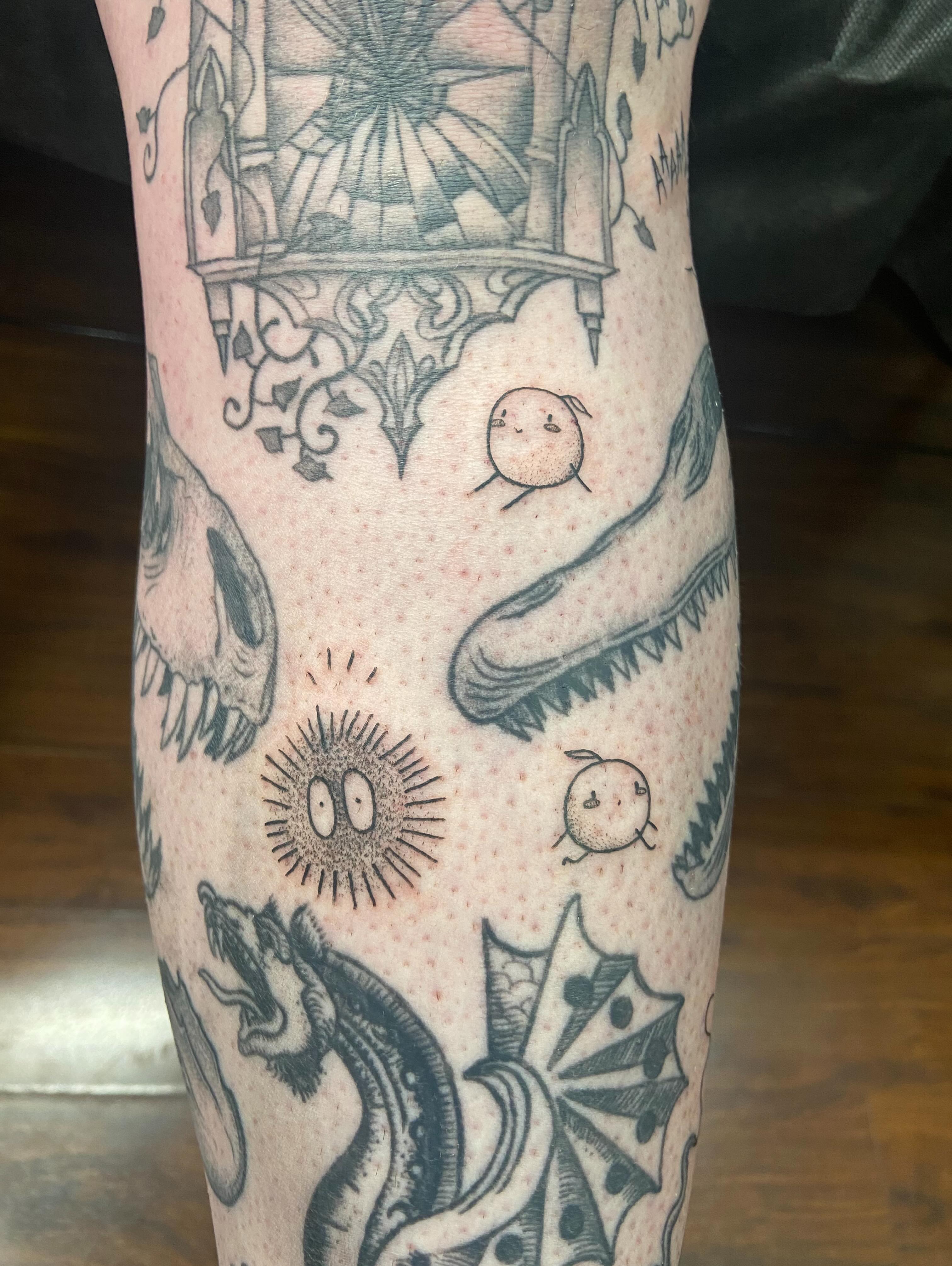 Astronauts, skull, snake, sun black and grey tattoo on the forearm by Holly Redwinter