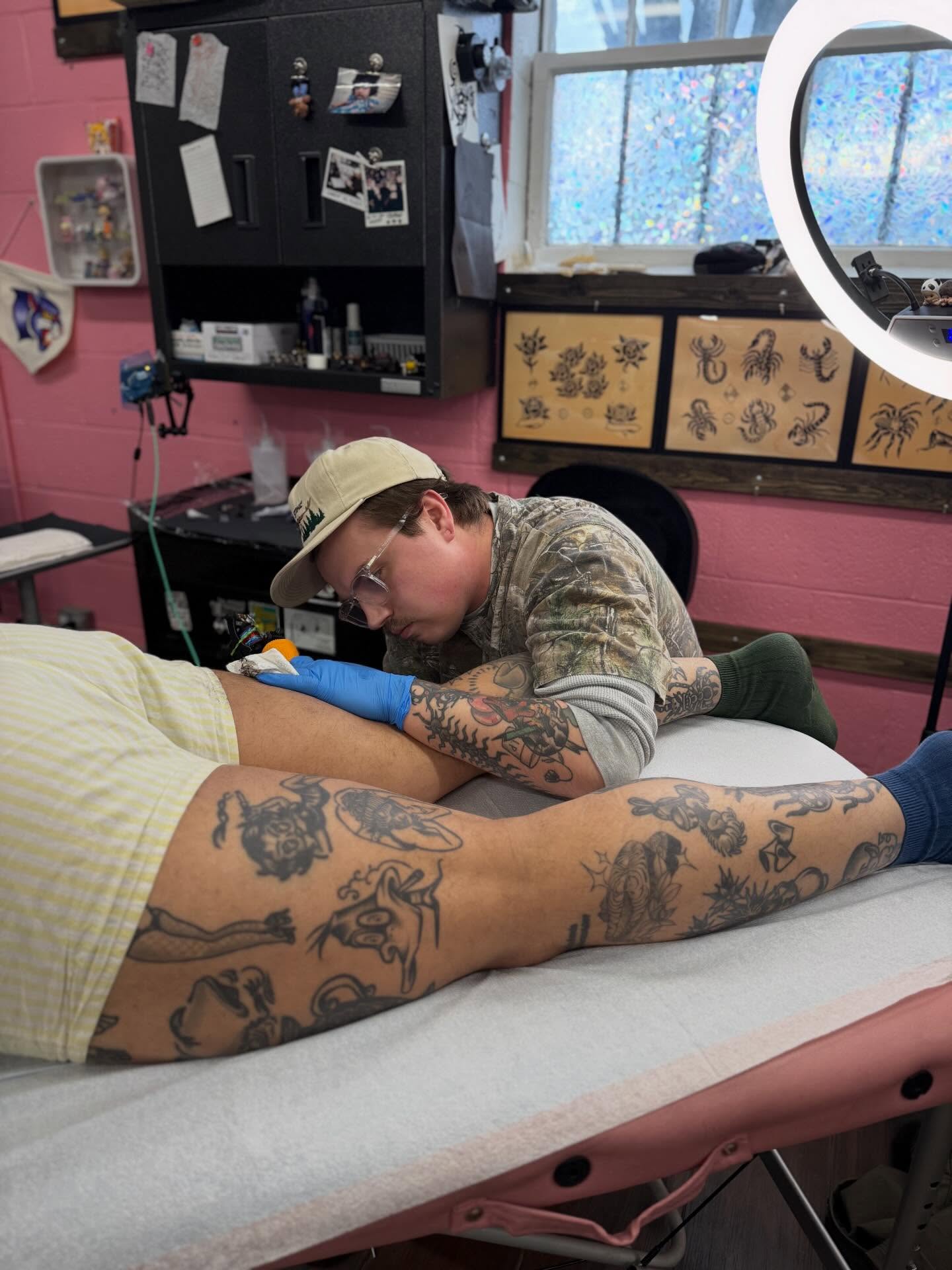 Lion and dragon American traditional tattoo on the thigh by Cody Petkus