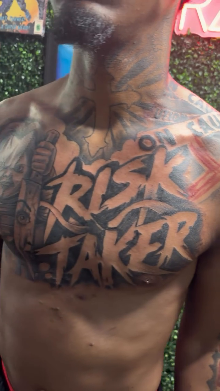 Risk Taker chest tattoo Chicano tattoo on the chest by DOE๐๐น