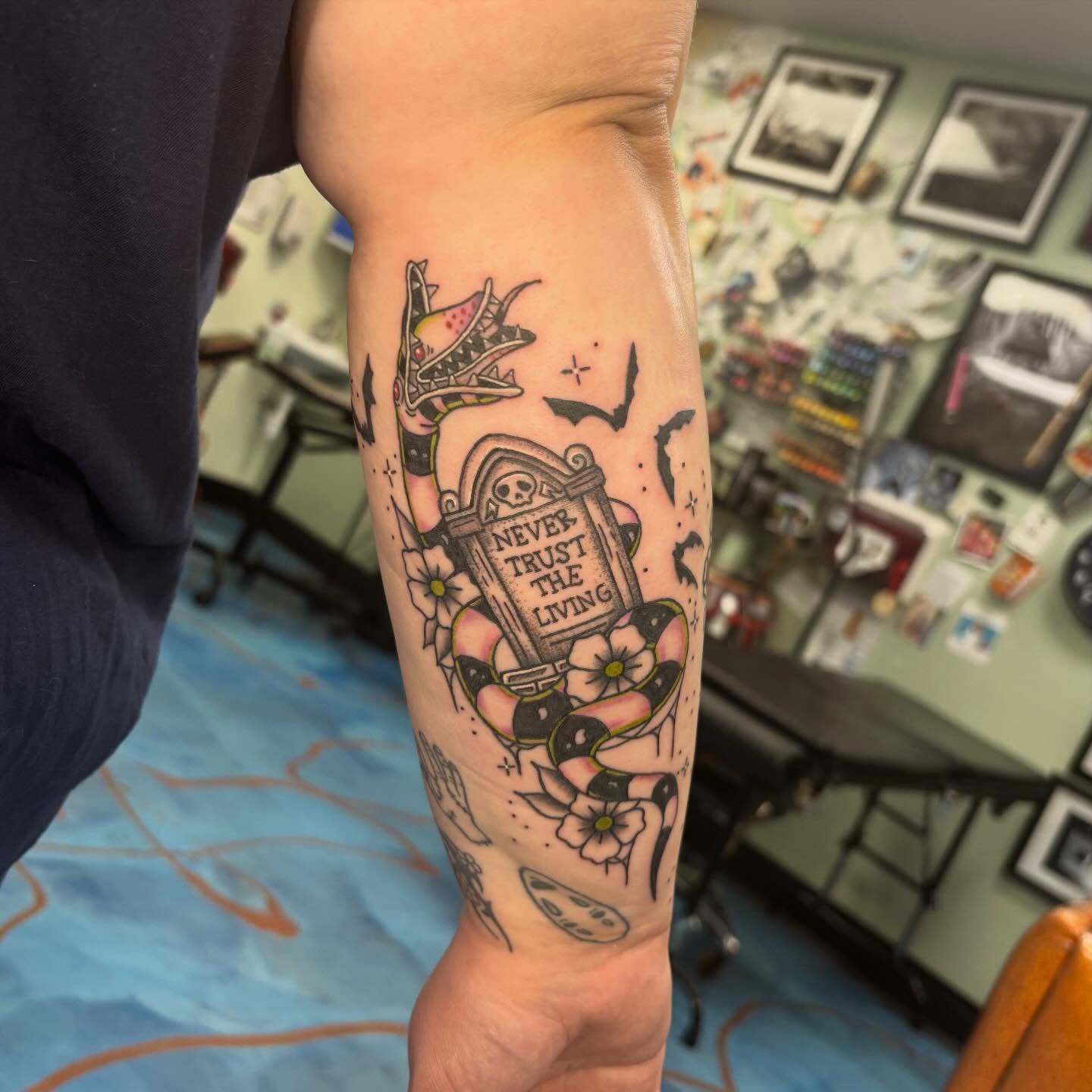 Graveyard scene American traditional tattoo on the forearm by Cam Sykes