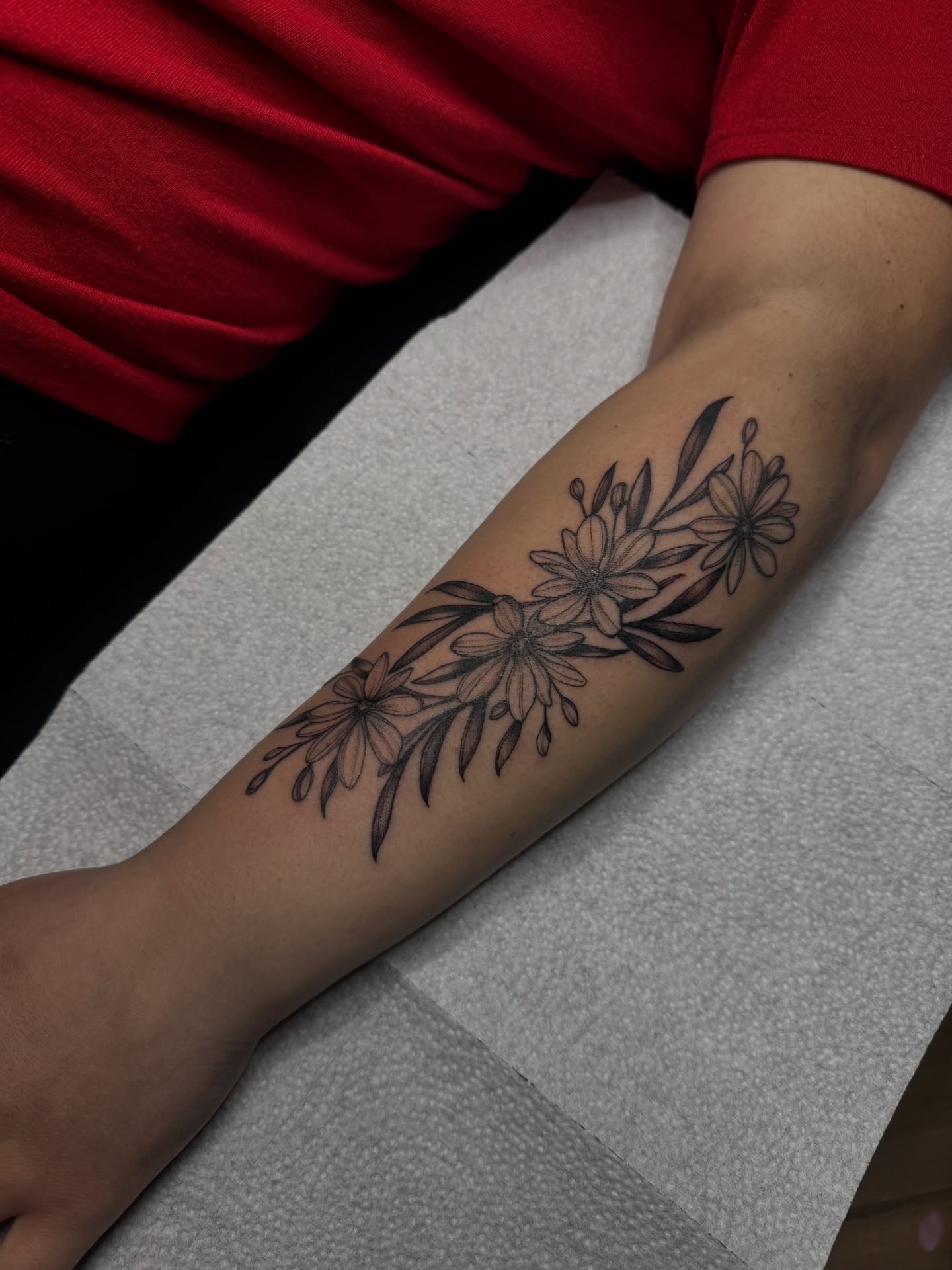 Flowers black and grey tattoo on the forearm by Saffron Florea, Tiffin, Ohio