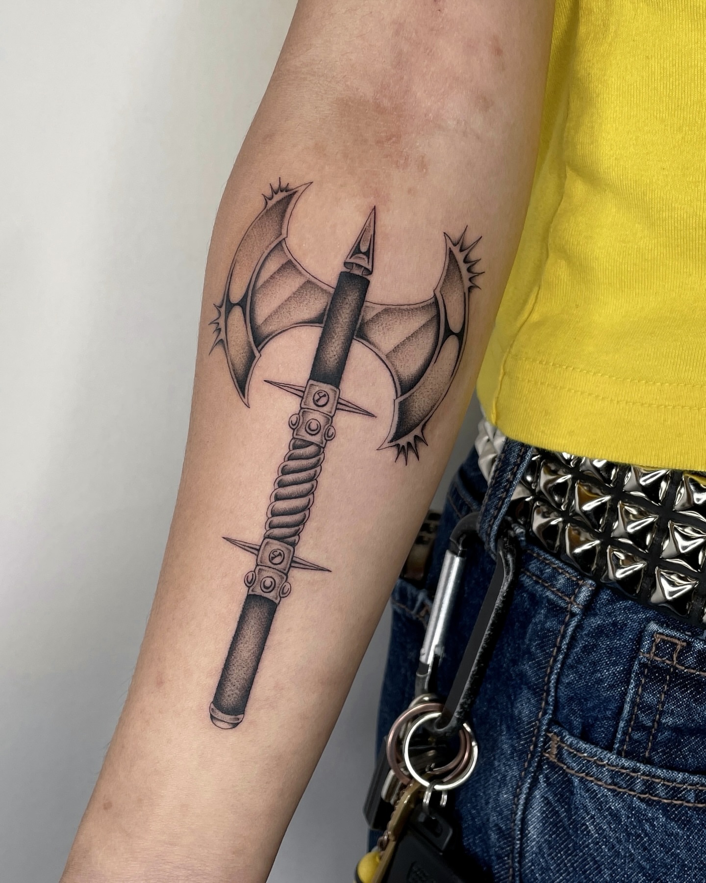 Battle axe black and grey tattoo on the forearm by IVY