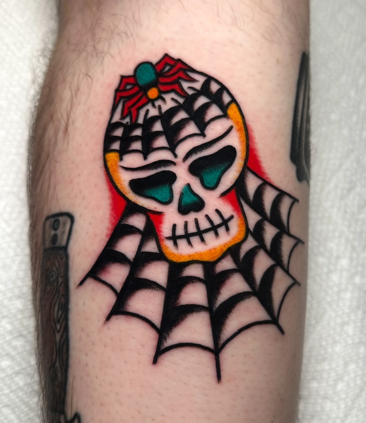 Skull American traditional tattoo on the forearm by Zahra Niedermann