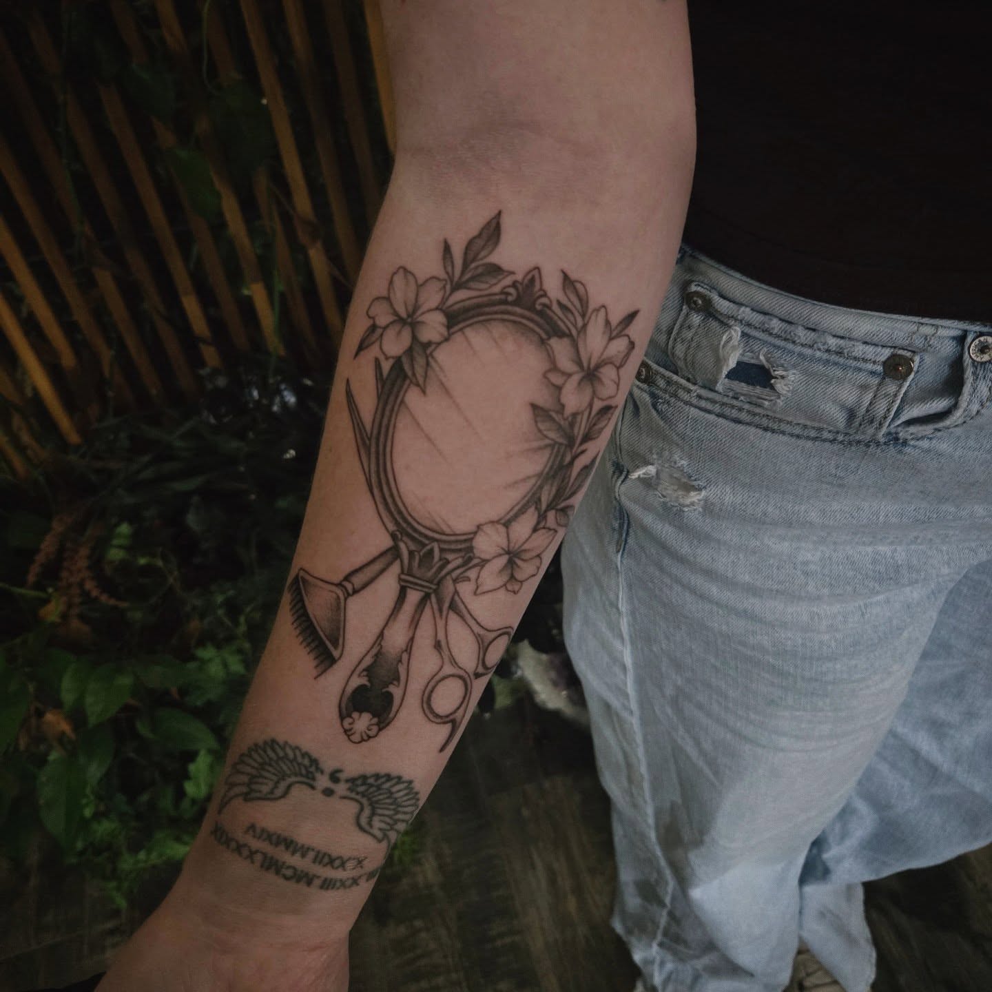 Mirror and flowers black and grey tattoo on the forearm by Alexandra Colella ✨️
