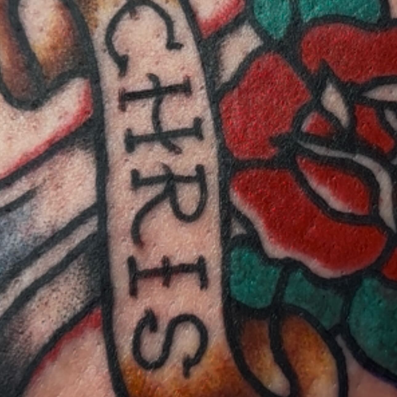 Name American traditional tattoo on the forearm by Olive Kelley