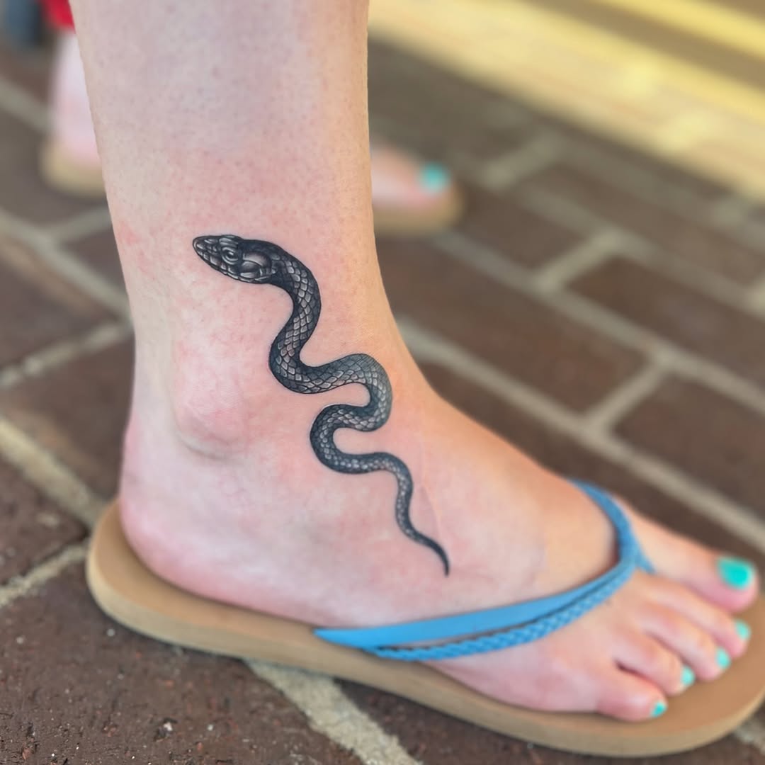 Snake American traditional tattoo on the foot by Jai Woods
