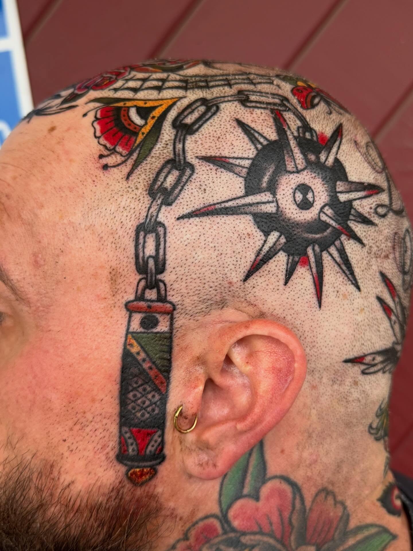 Compass and chain American traditional tattoo on the head by David Evans