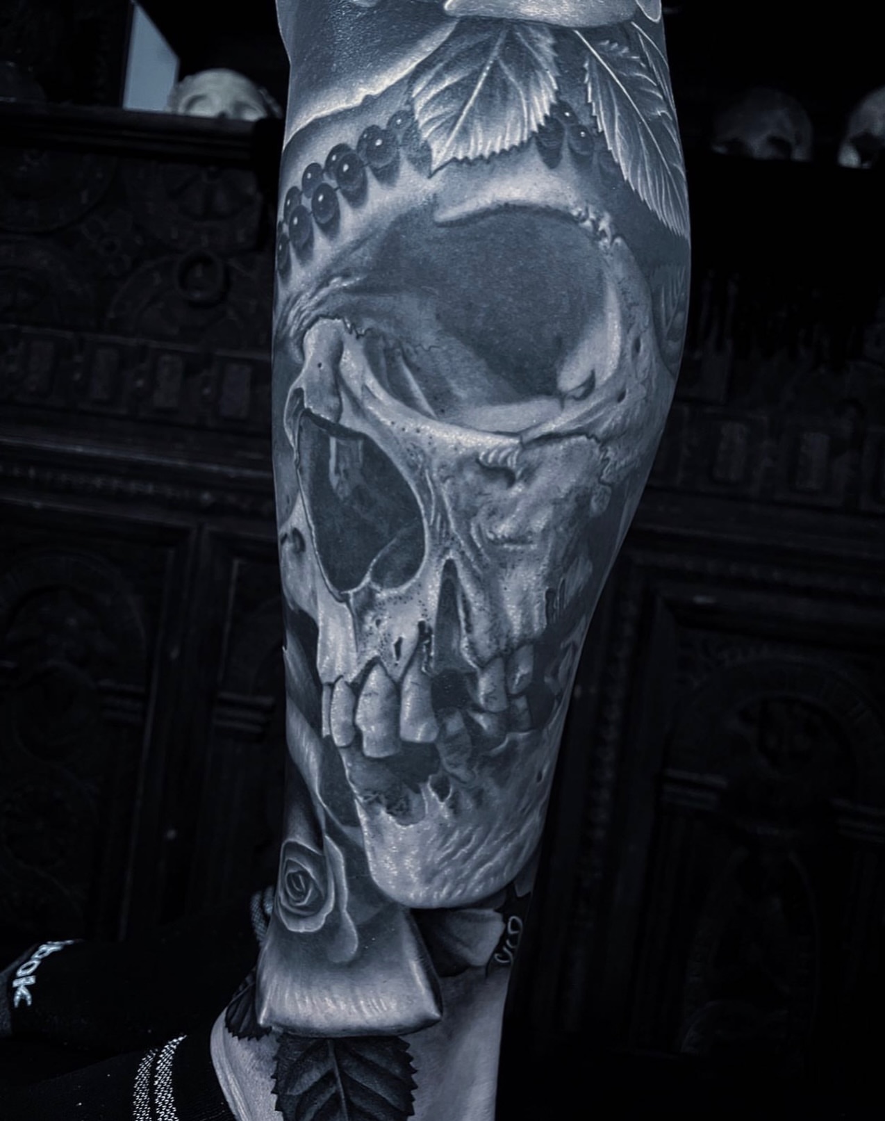 Skull and roses dark art tattoo on the forearm by Gabriel Londis