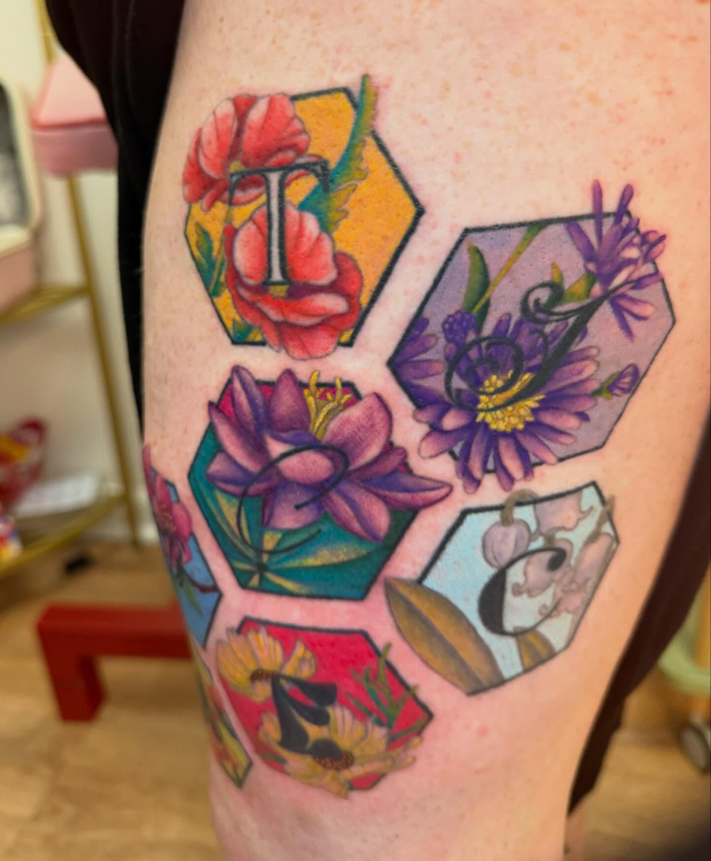 Floral alphabet new school tattoo on the thigh by rocky love