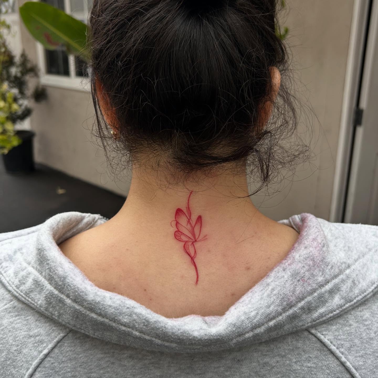 Abstract floral fine line tattoo on the neck by Birdy Tattoos π€