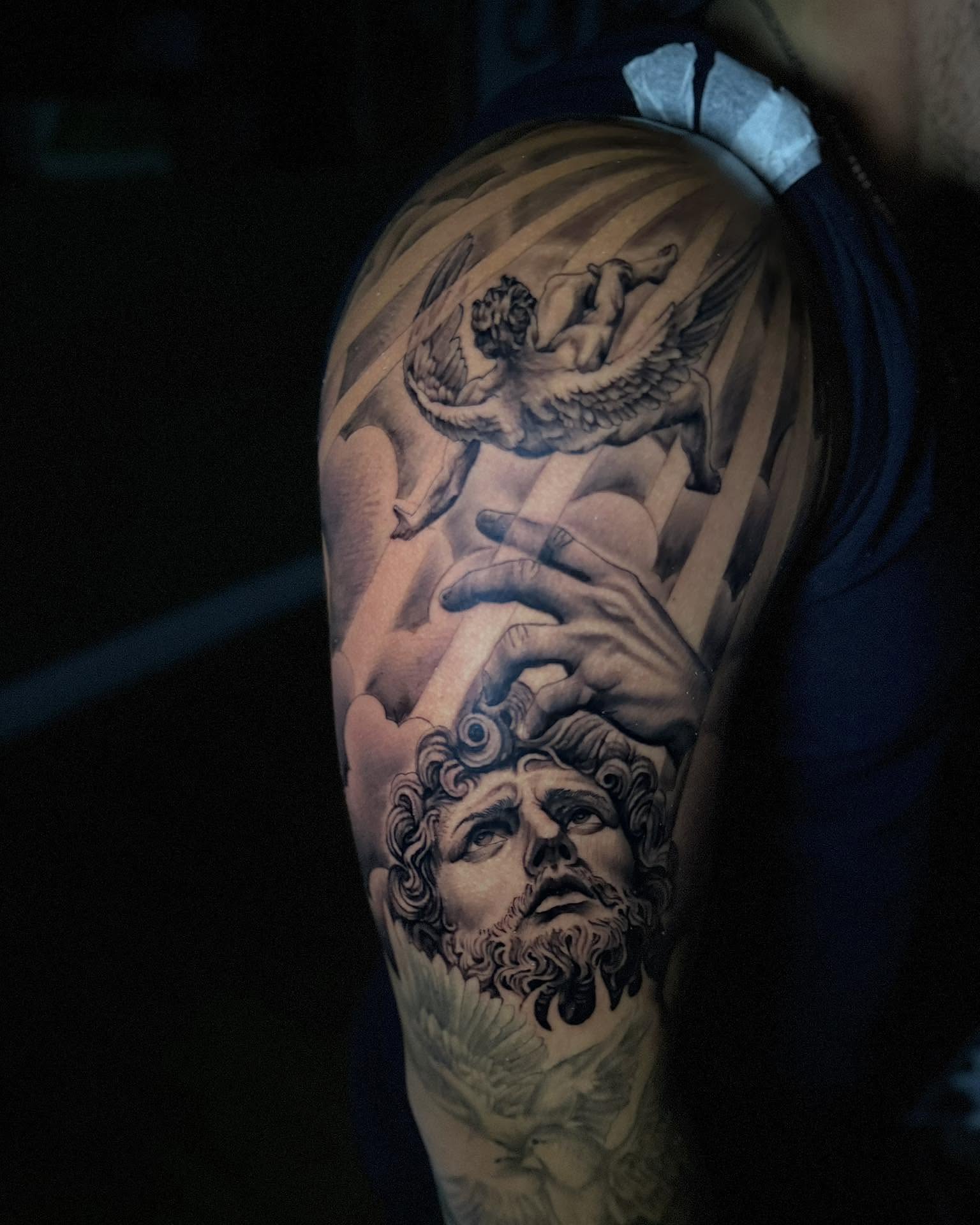 Mythological scene realism tattoo on the upper arm by Corey Bailey, Stanton, Kentucky
