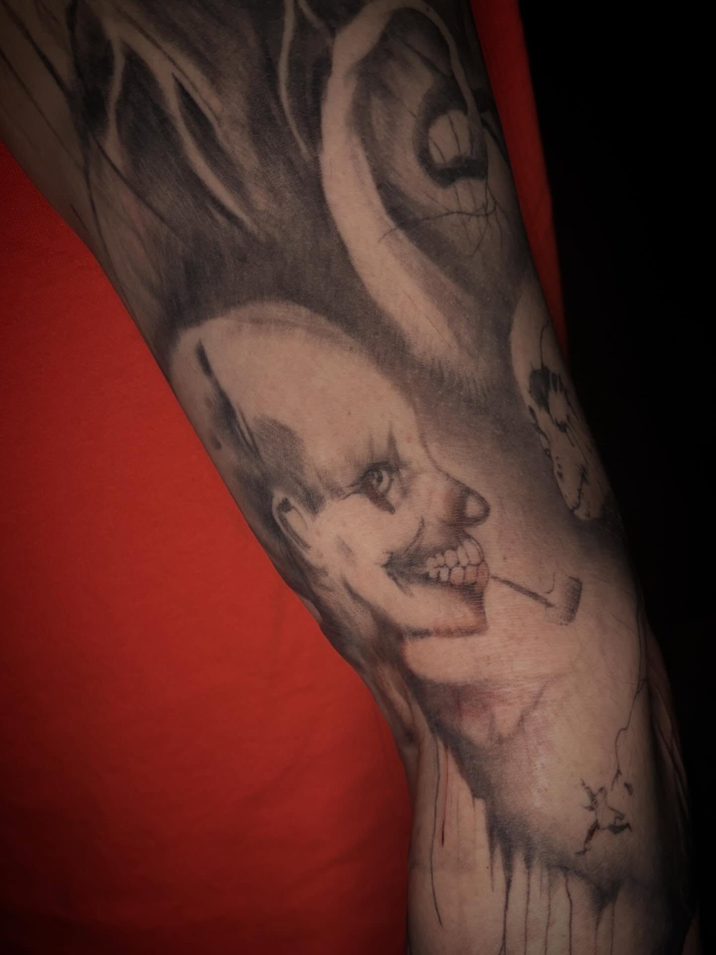 Smiling clown realism tattoo on the forearm by Cassandra Colleen