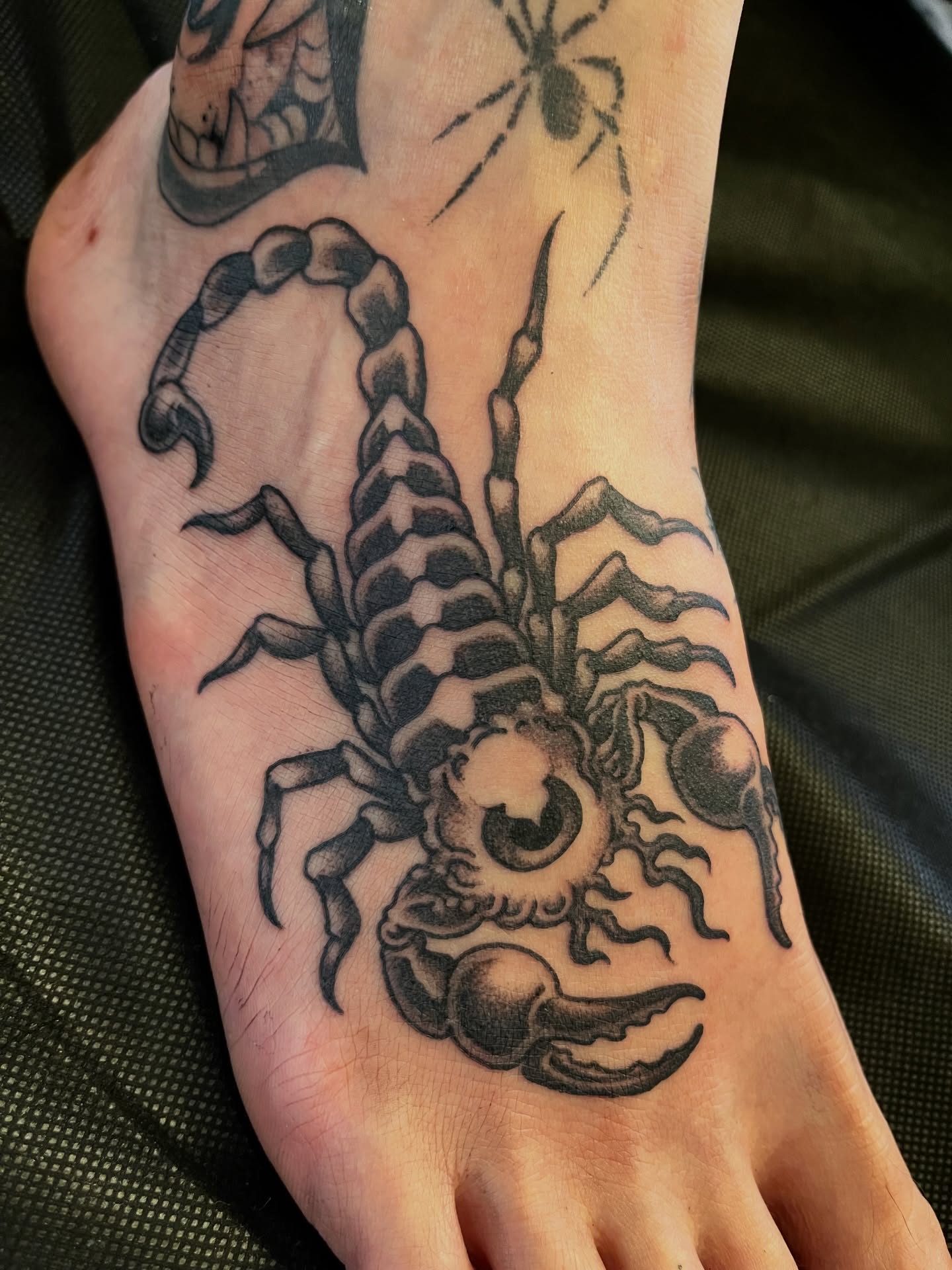 Scorpion black and grey tattoo on the foot by Campbell Zane Alexander