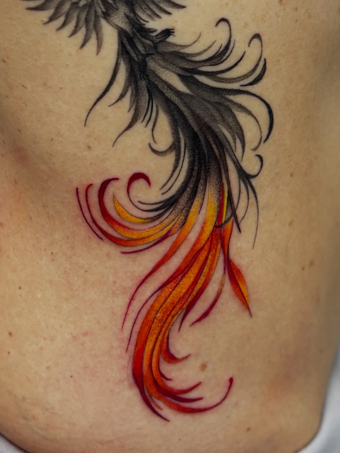 Flame new school tattoo on the back by Elise Lamoureux- Tattoo Artist, Airdrie, Alberta