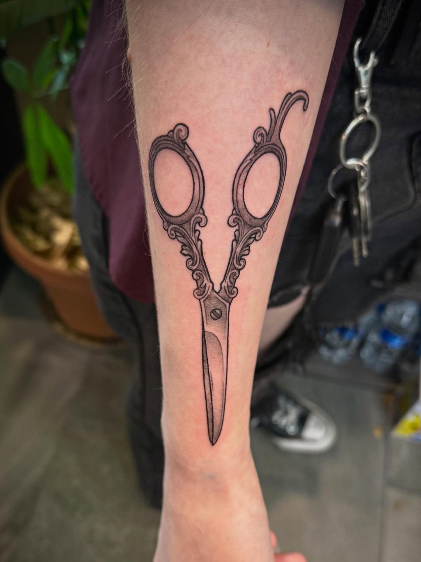 Scissors black and grey tattoo on the forearm by Ashley Kayser