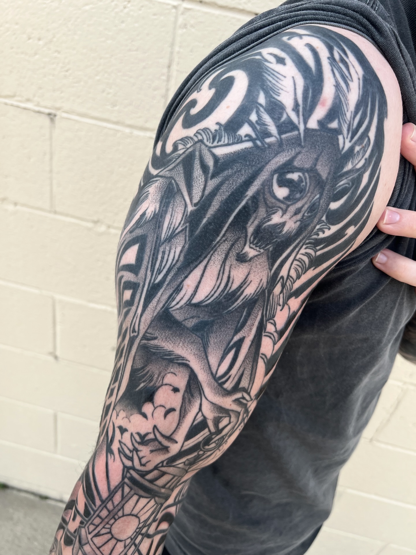 Horse and rider realism tattoo on the upper arm by Nathan Garcia
