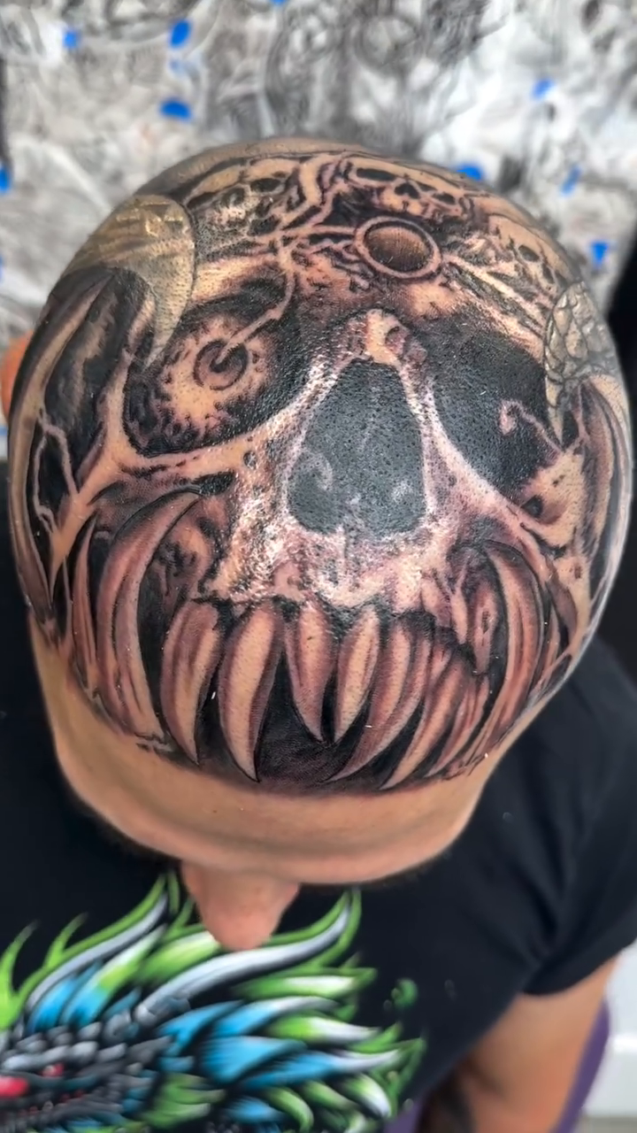 Skull with teeth realism tattoo by Steve Bishov