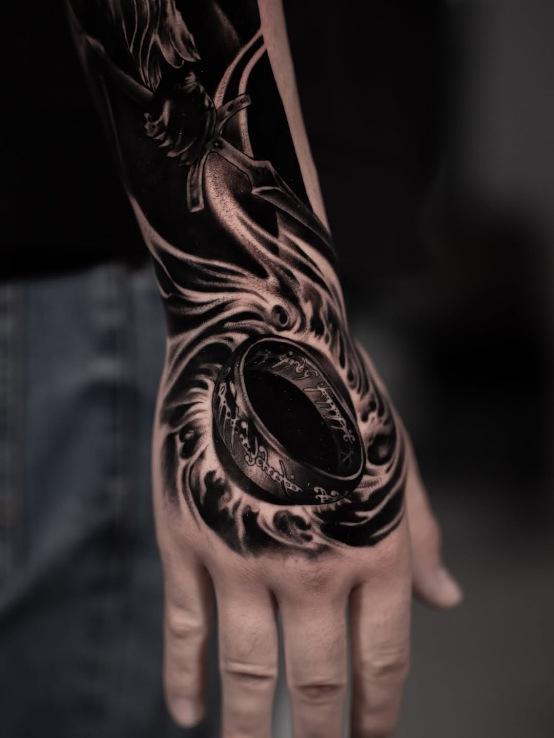 The One Ring and sword realism tattoo on the hand by Andres Pabon Tattoo Artist
