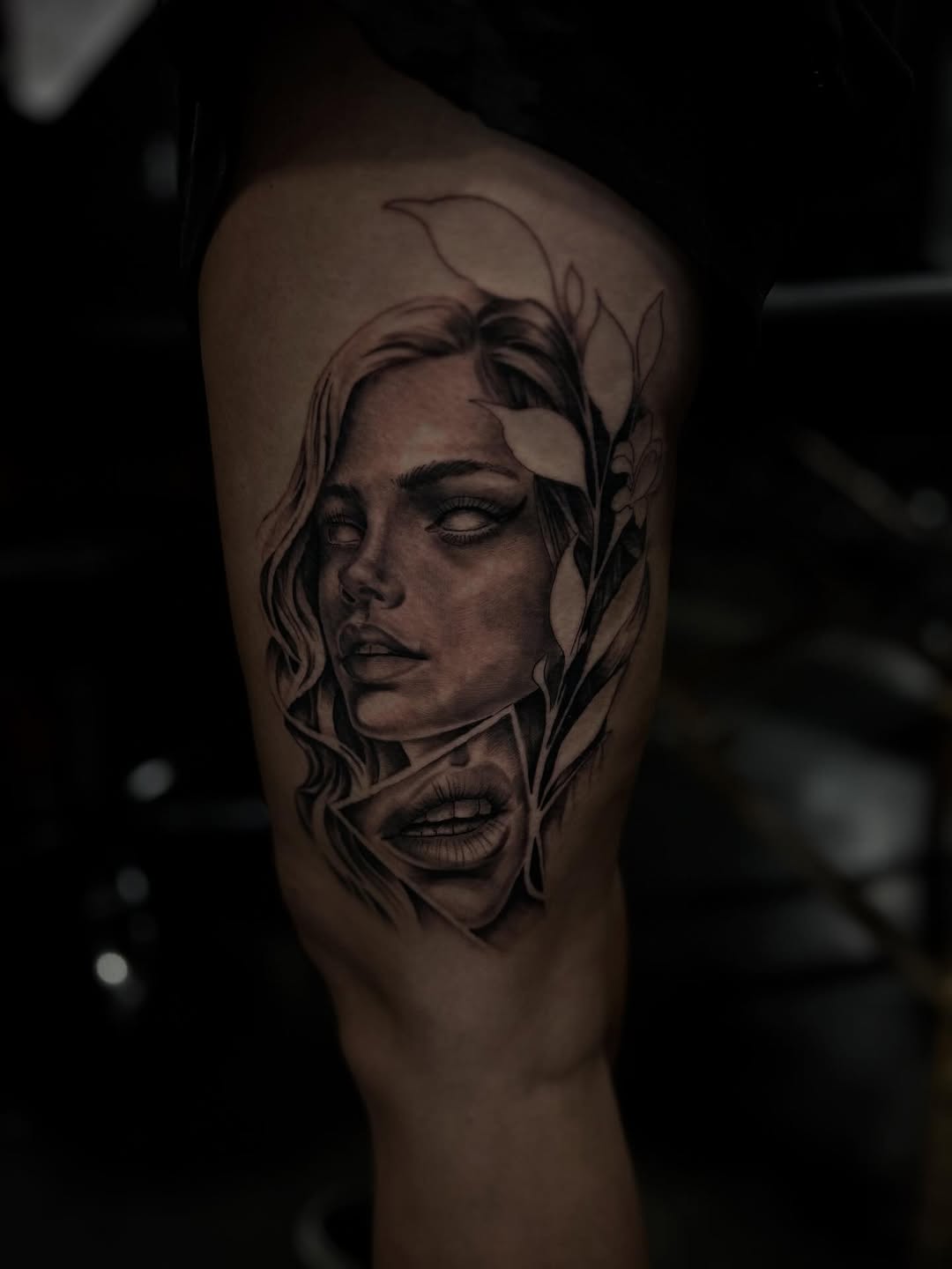 Surreal portrait with lips realism tattoo on the thigh by Dylan Stevens