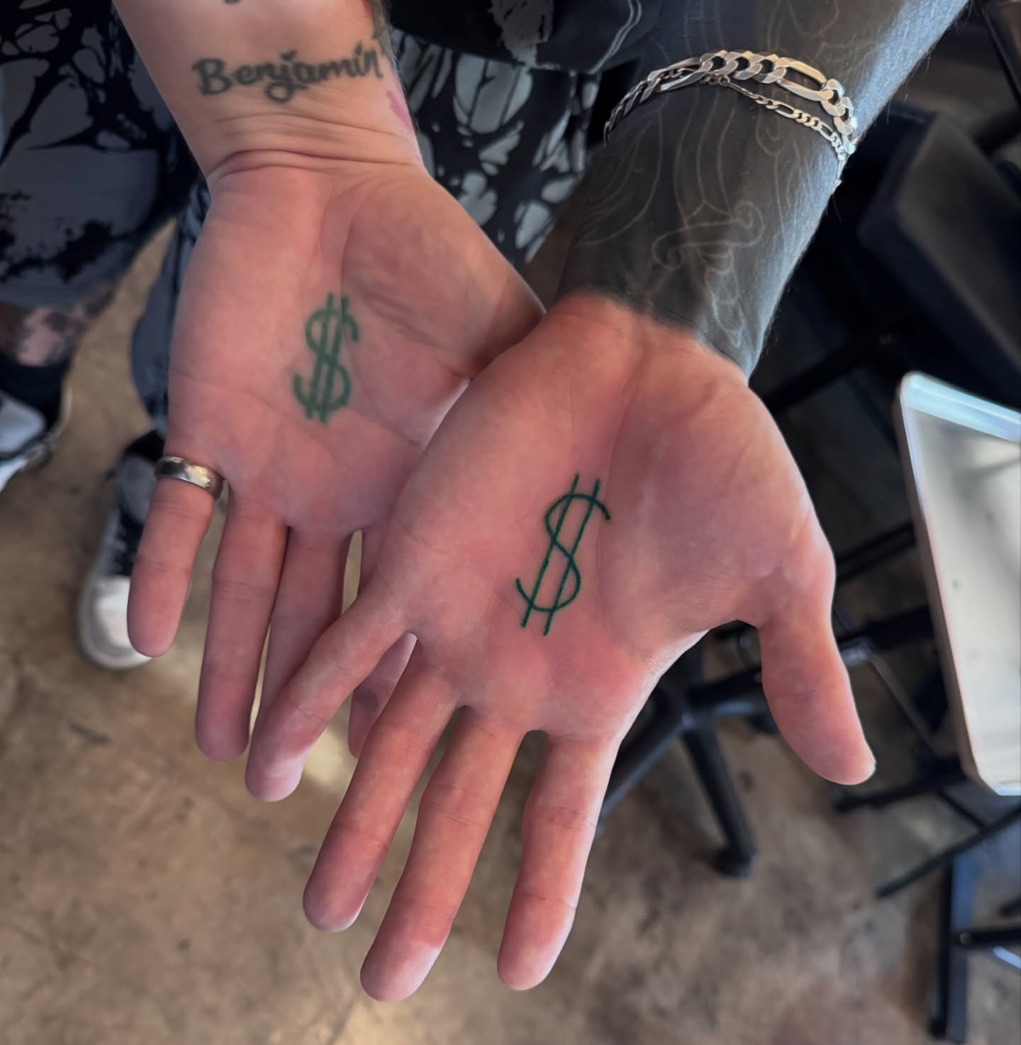 Dollar sign dotwork tattoo on the hand by Sideshow Danny