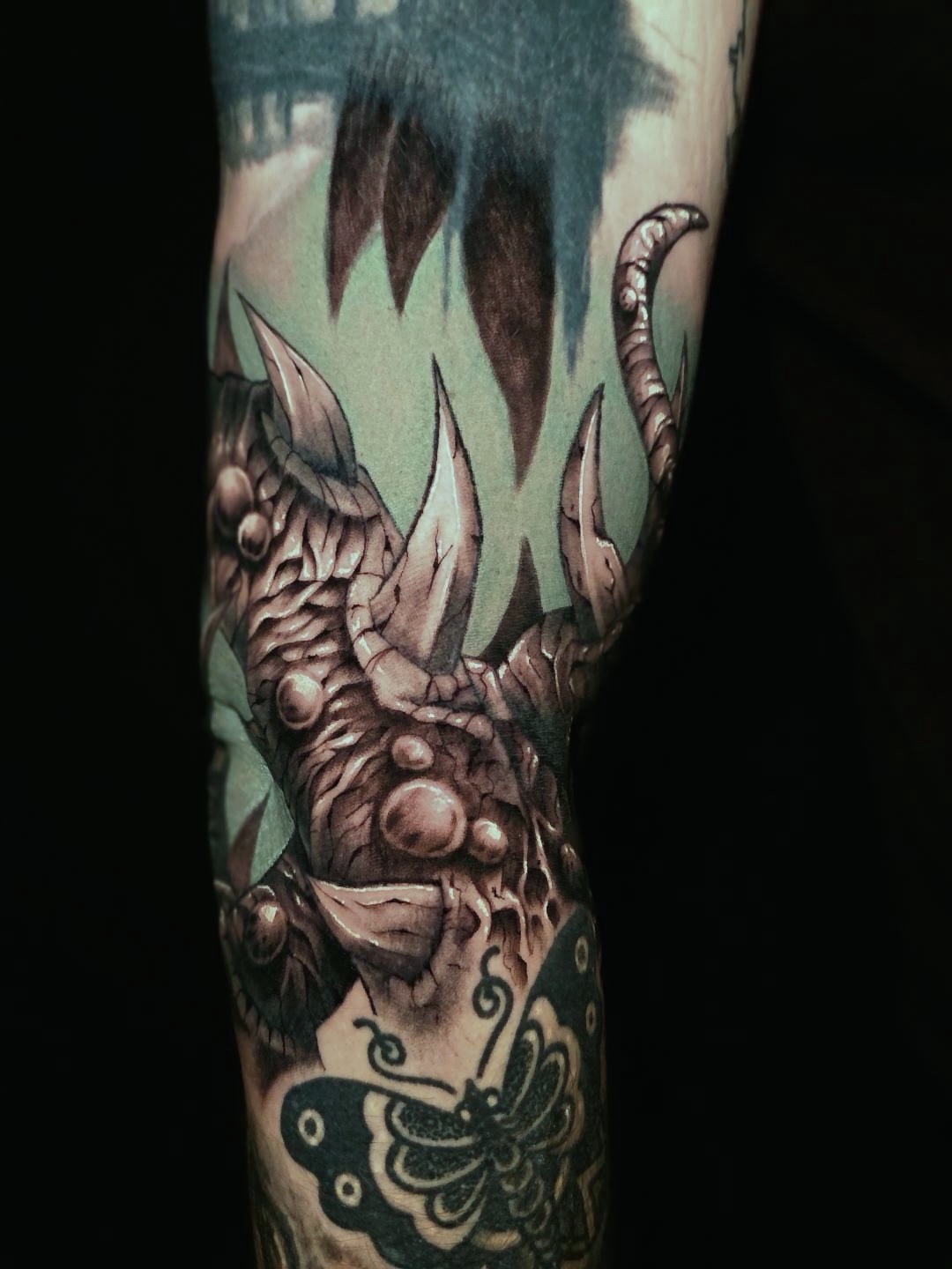 Monster hand realism tattoo on the forearm by Jake Barney