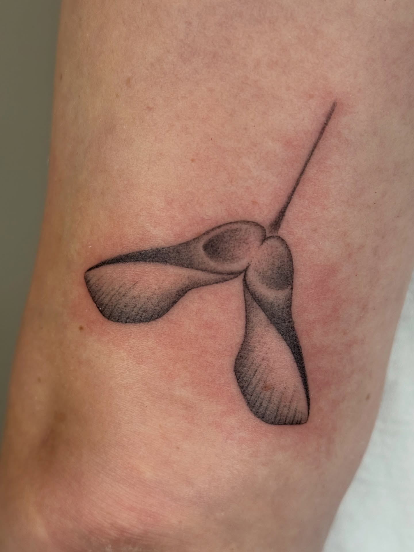 Wind turbine black and grey tattoo on the forearm by Monica Reynolds