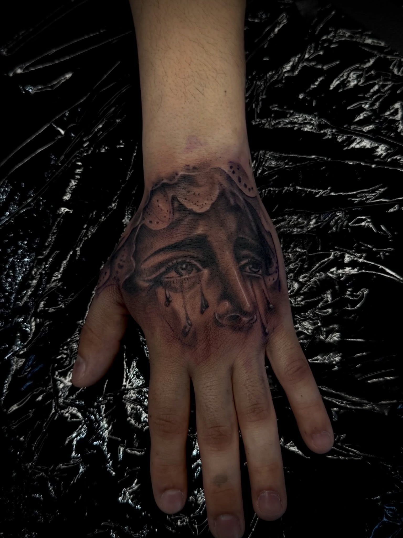 Tearful face realism tattoo on the hand by Santi🎲