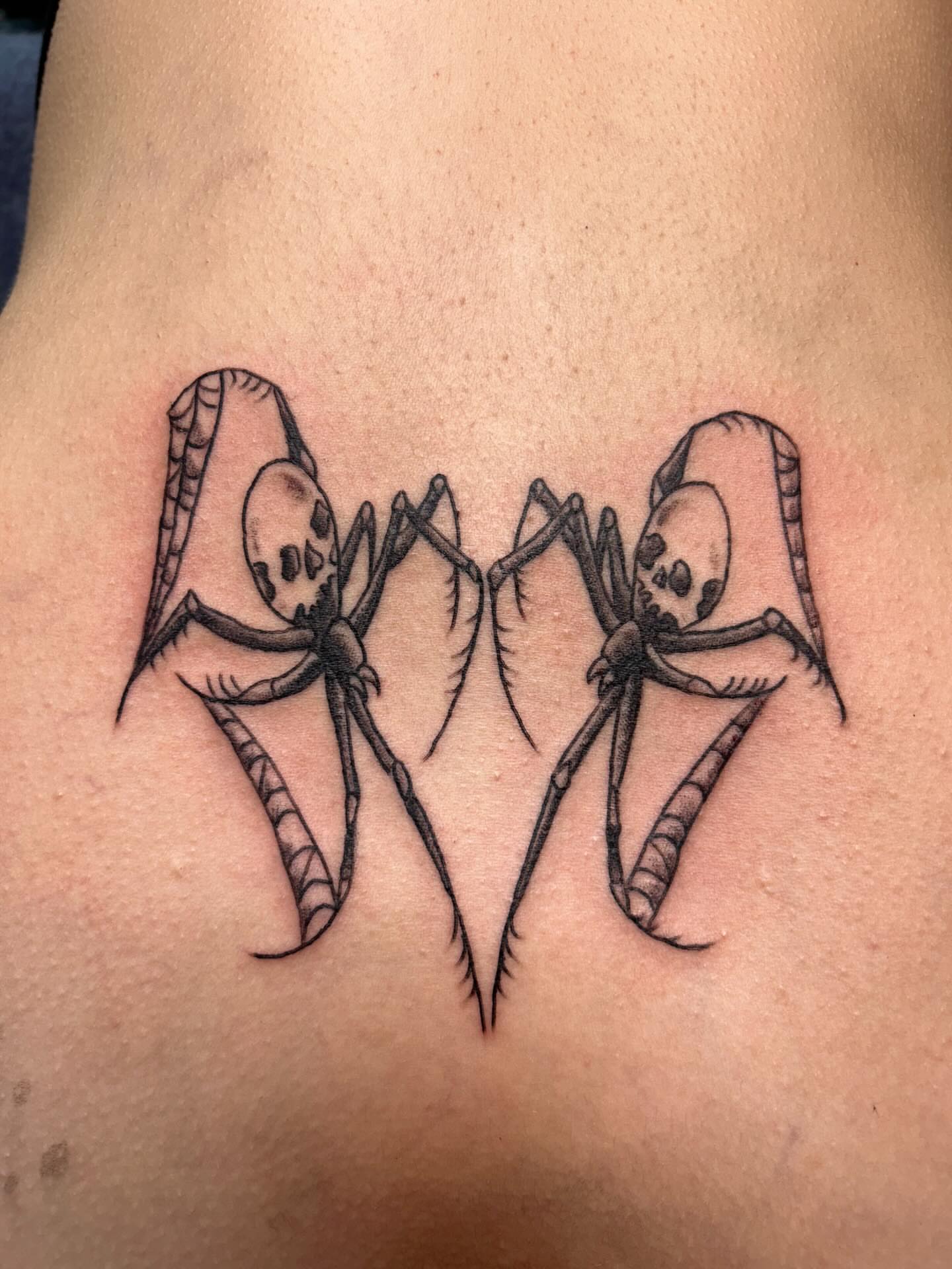 Spiders black and grey tattoo on the back by Stogie Tony