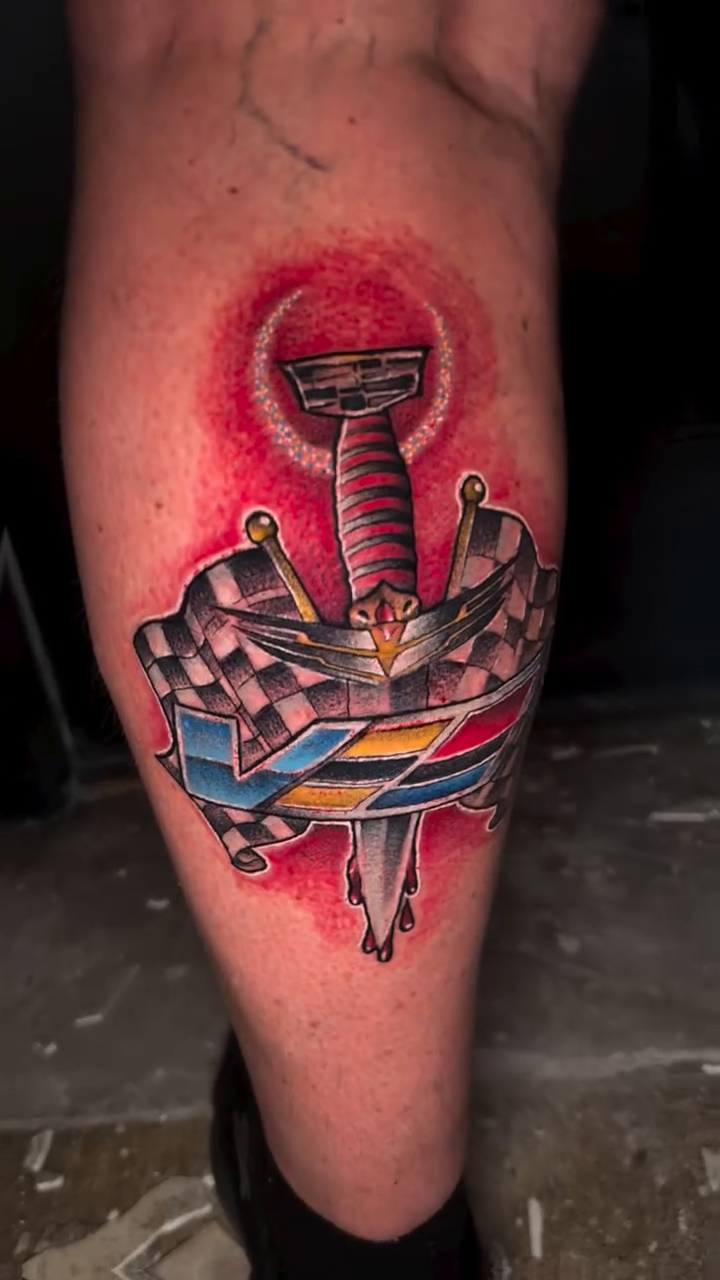 Cadillac emblem with sword and flags American traditional tattoo by Alex Wheelock