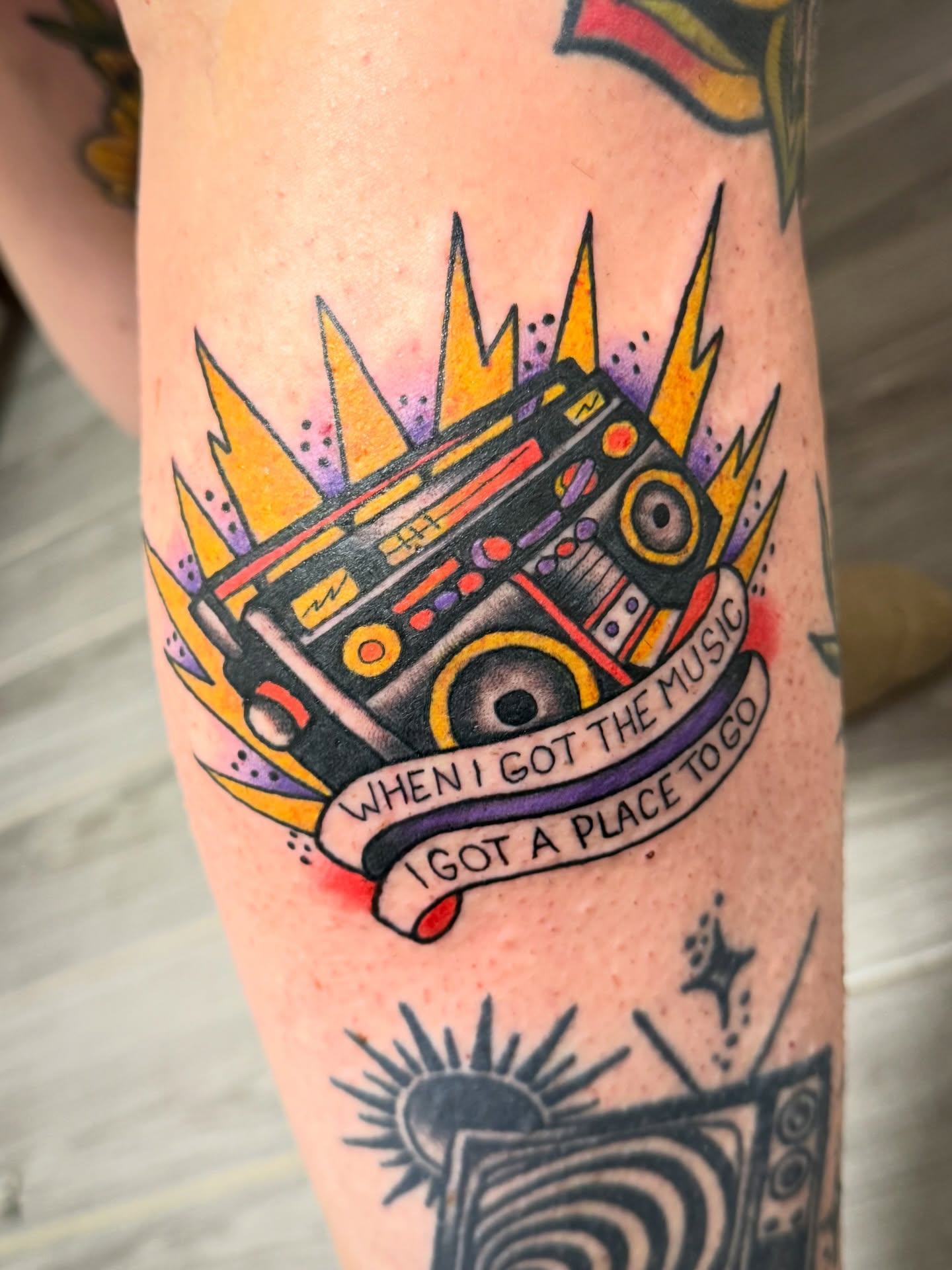 Boombox with lightning bolts American traditional tattoo on the forearm by Shannon Pagliarini