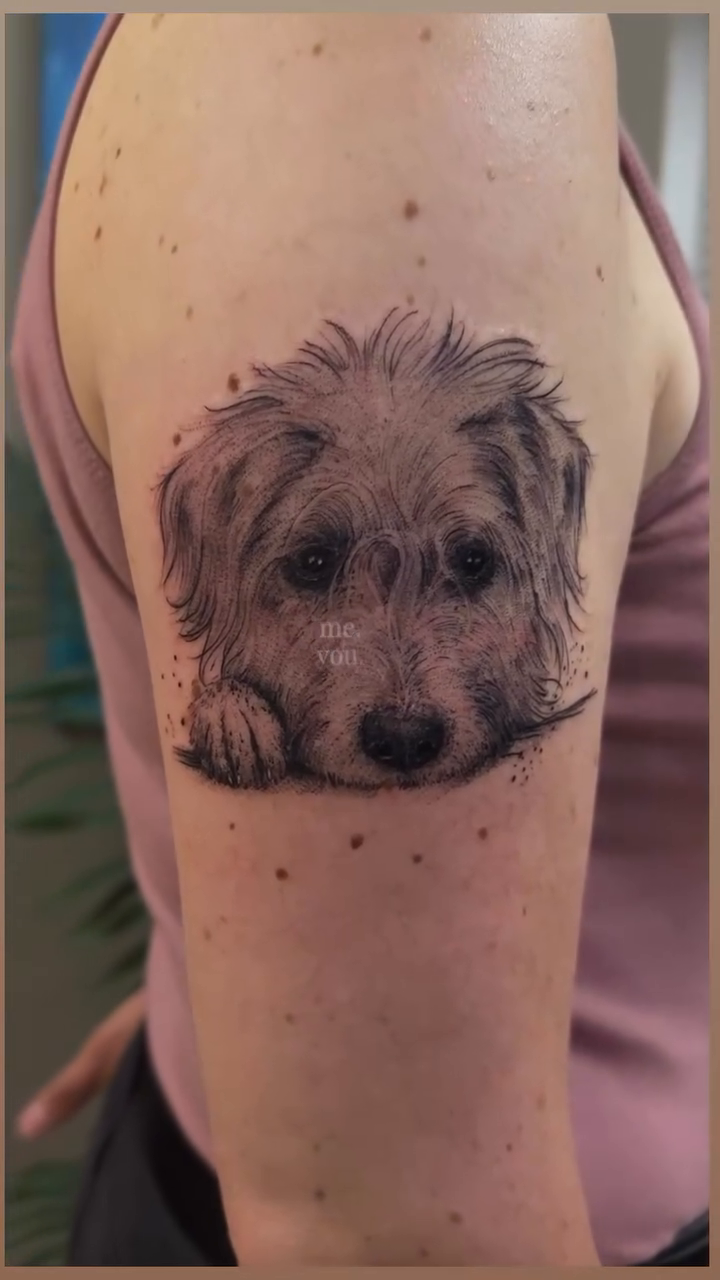 Dog portrait realism tattoo on the upper arm by Die Ivo, Bielefeld, Germany