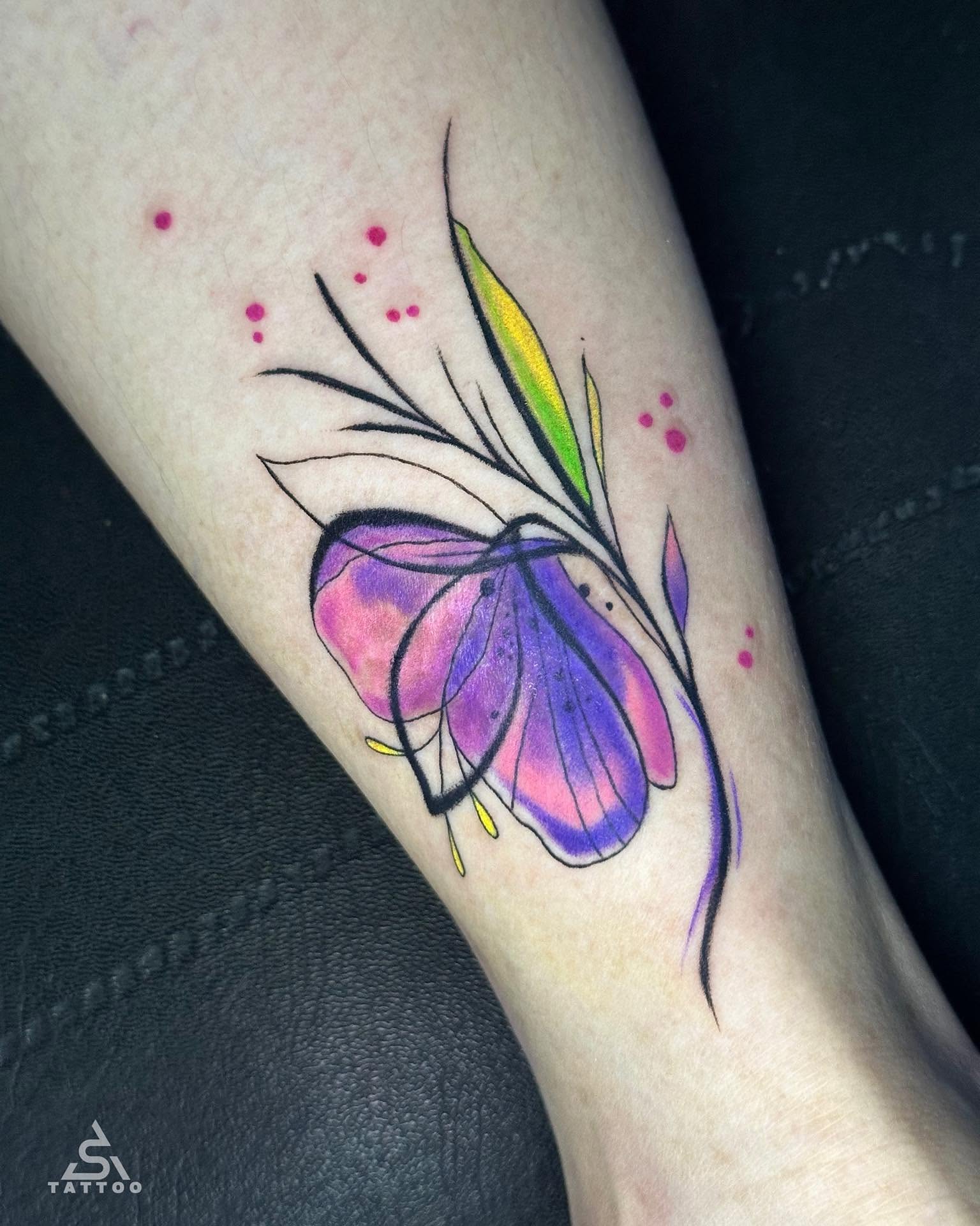 Butterfly watercolor tattoo on the forearm by Stephen Degracia