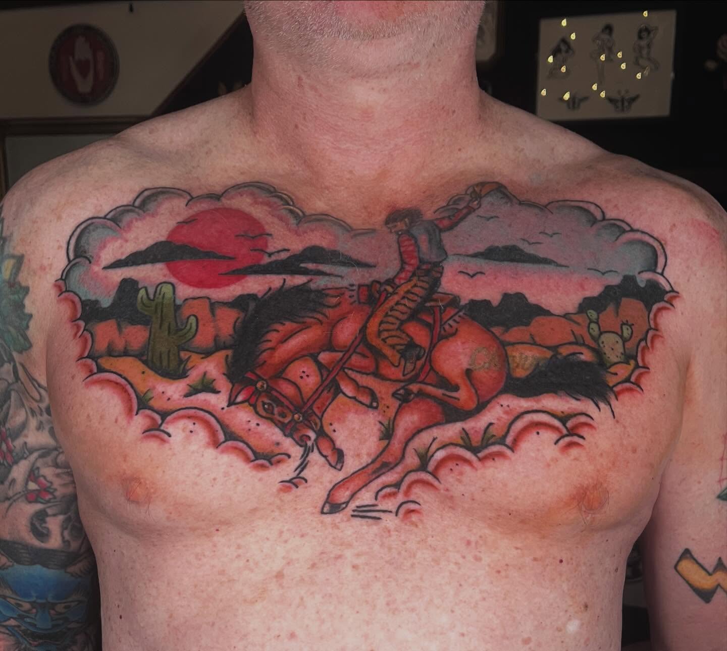 Western landscape American traditional tattoo on the chest by madelynne (maddie) caldwell tattoos
