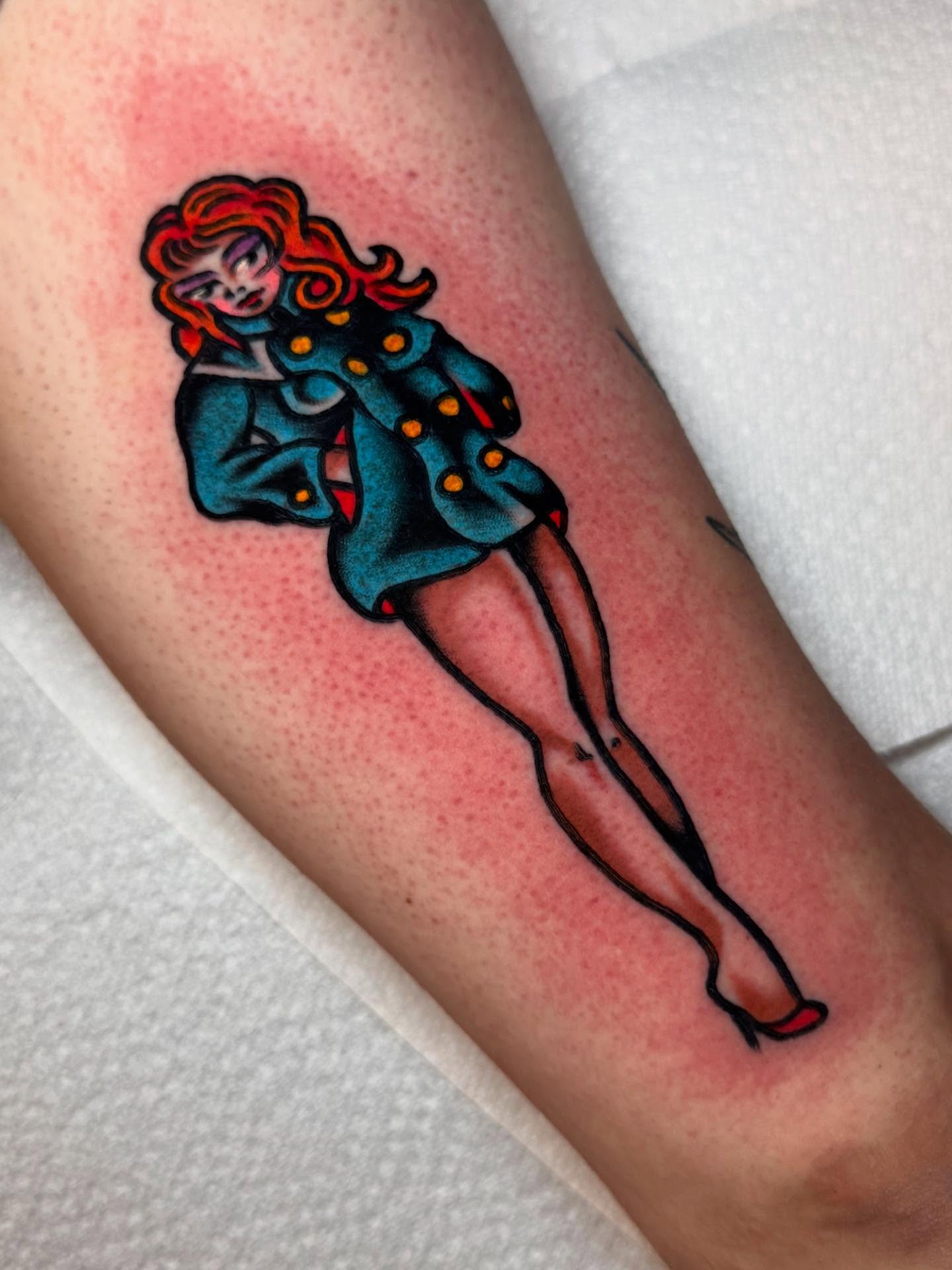 Pin-up girl American traditional tattoo on the forearm by Jonathan Clapp, San Antonio, Texas