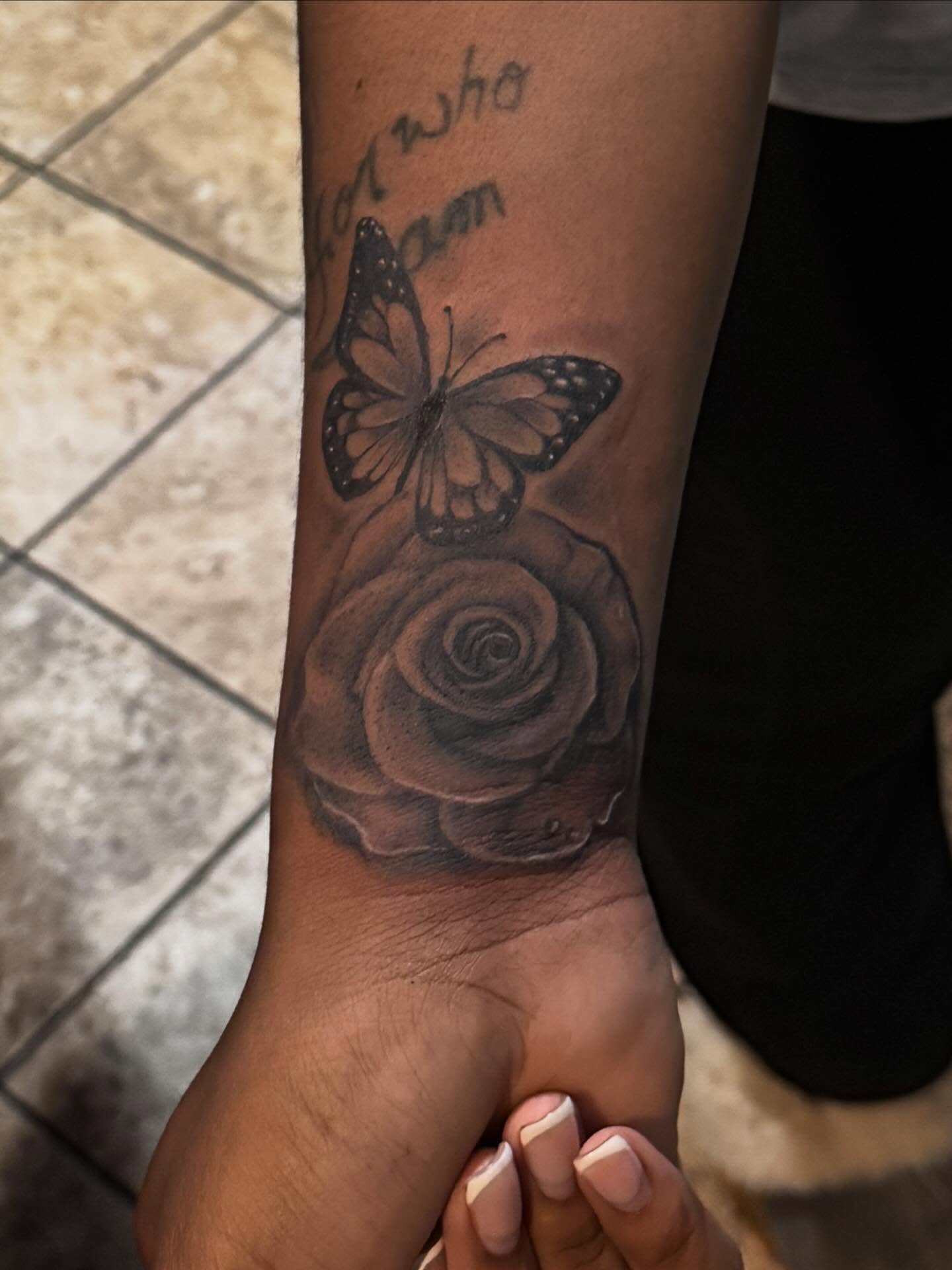 Rose and butterfly realism tattoo on the forearm by dallas tattoo artist, Duncanville, Texas
