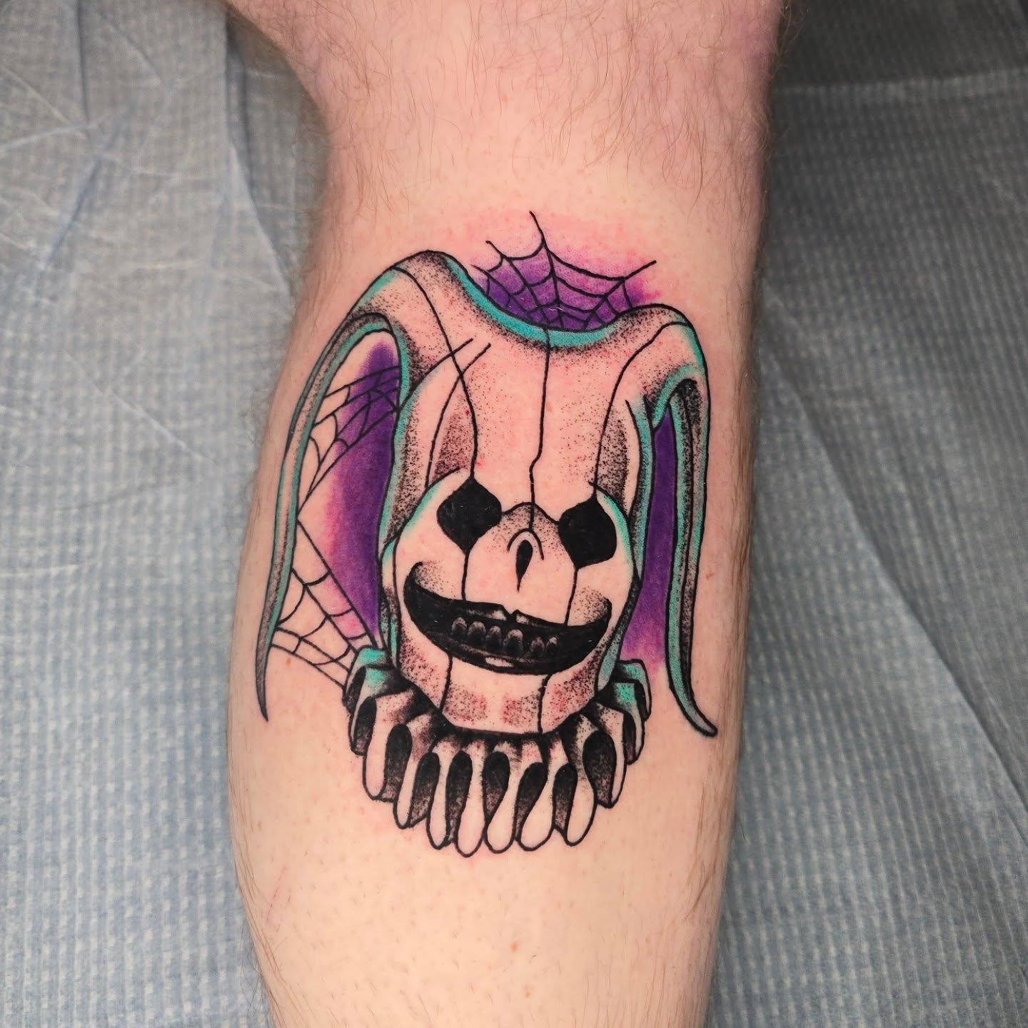 Clown skull American traditional tattoo on the forearm by Adison Essig