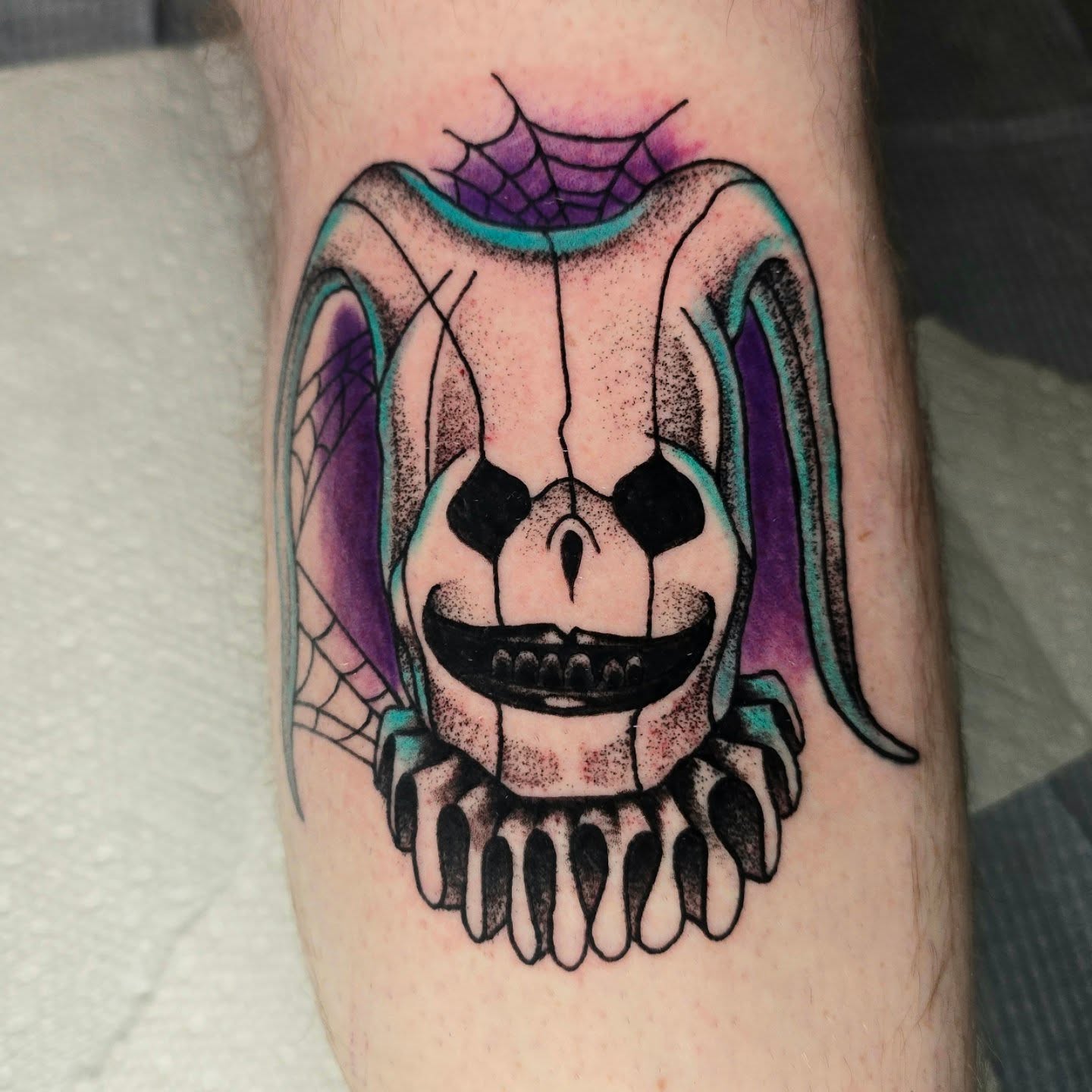 Skull dotwork tattoo on the forearm by Adison Essig