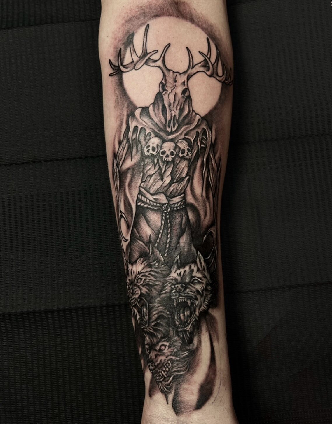 Deer skull with skulls black and grey tattoo on the forearm by abby ☽ marie