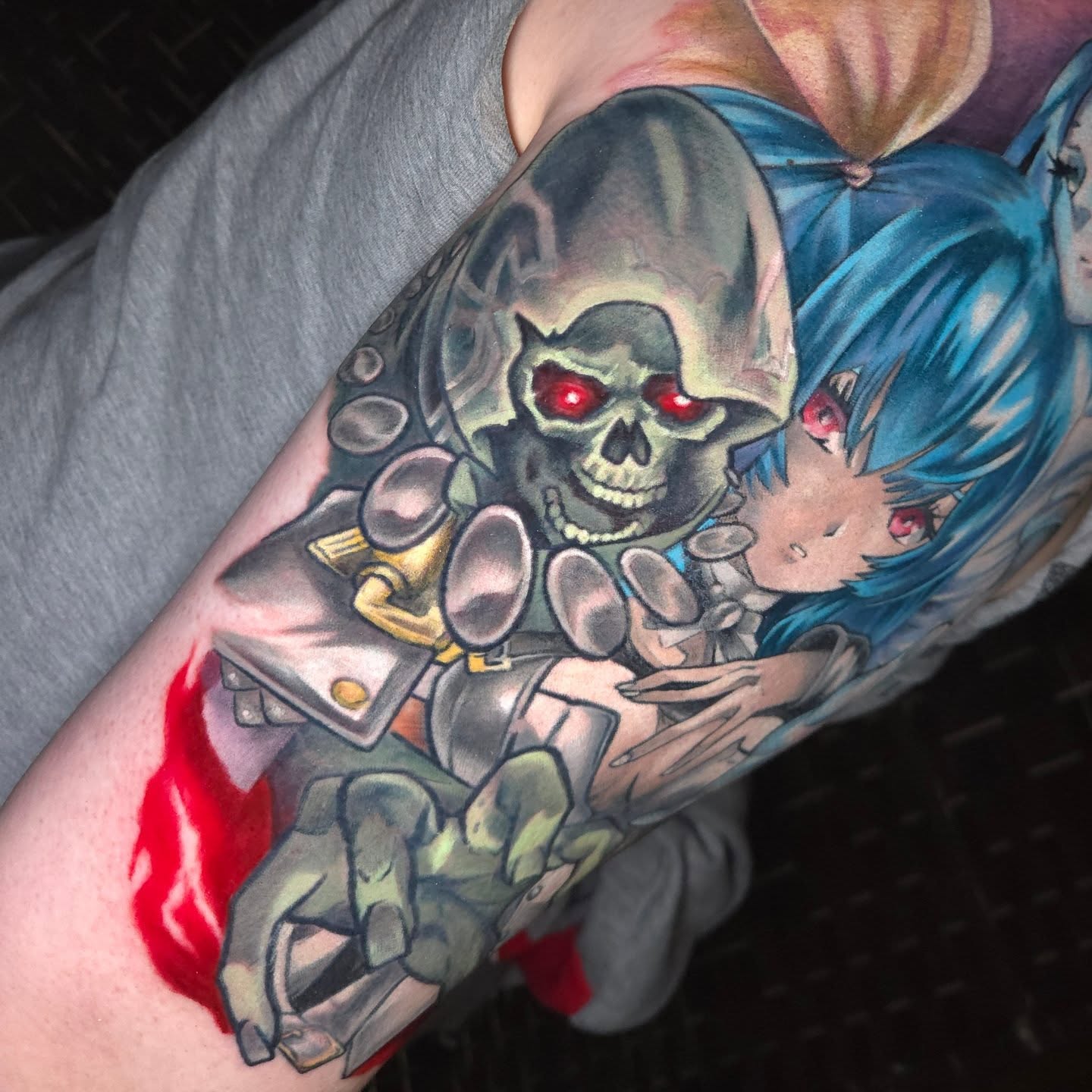 Cyborg skull and anime girl realism tattoo on the forearm by Nic Mann