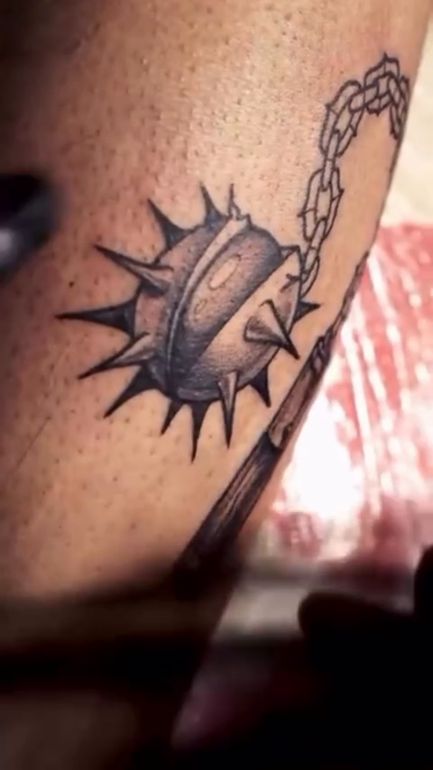 Mace and chain cyber sigilism tattoo on the upper arm by Elvira Savchuk
