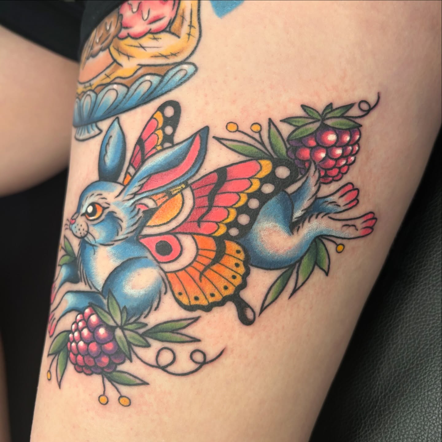 Rabbit with butterfly wings American traditional tattoo on the forearm by Audrey Migitsch
