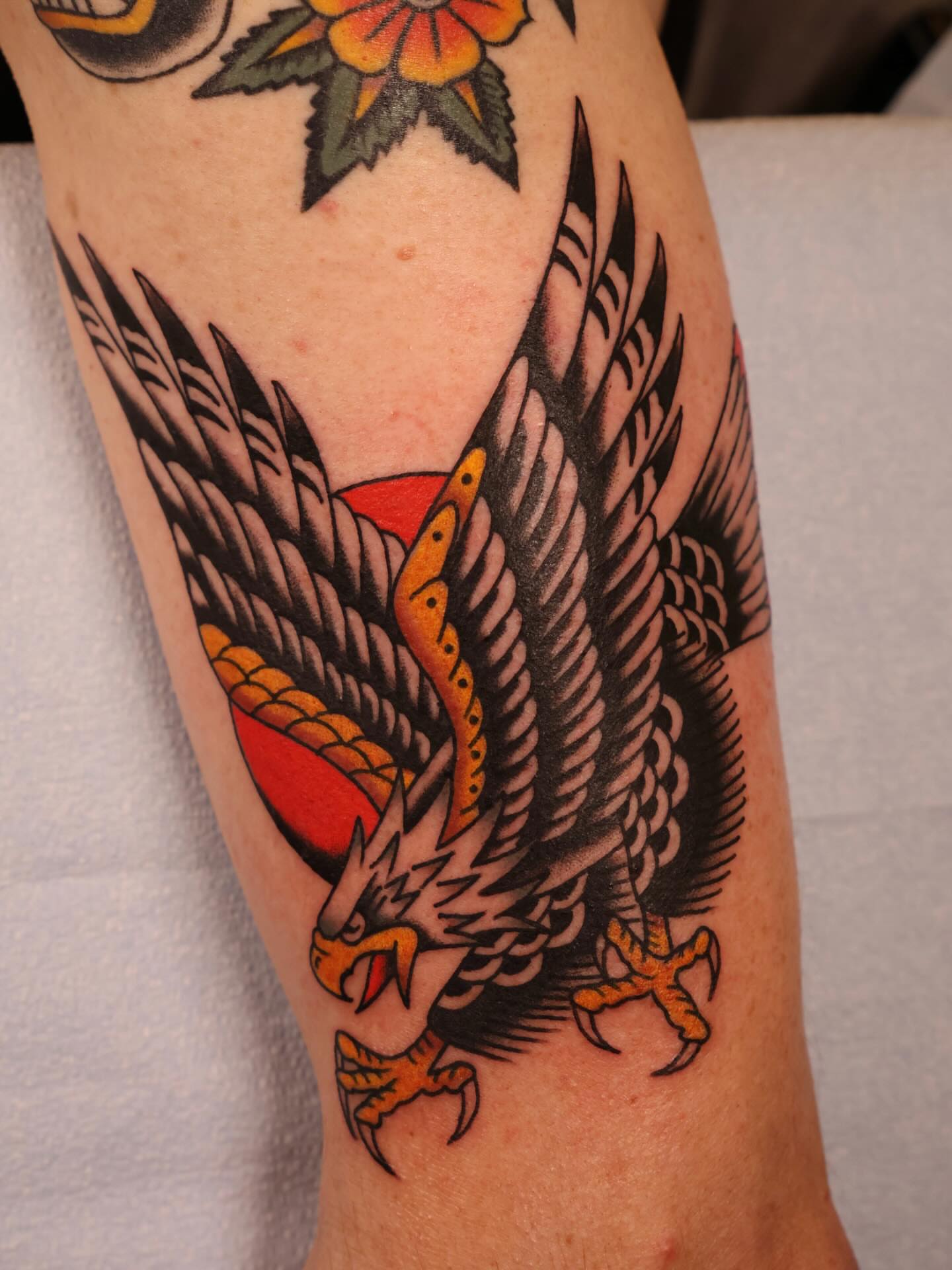 Eagle American traditional tattoo on the forearm by Justin Rakowski