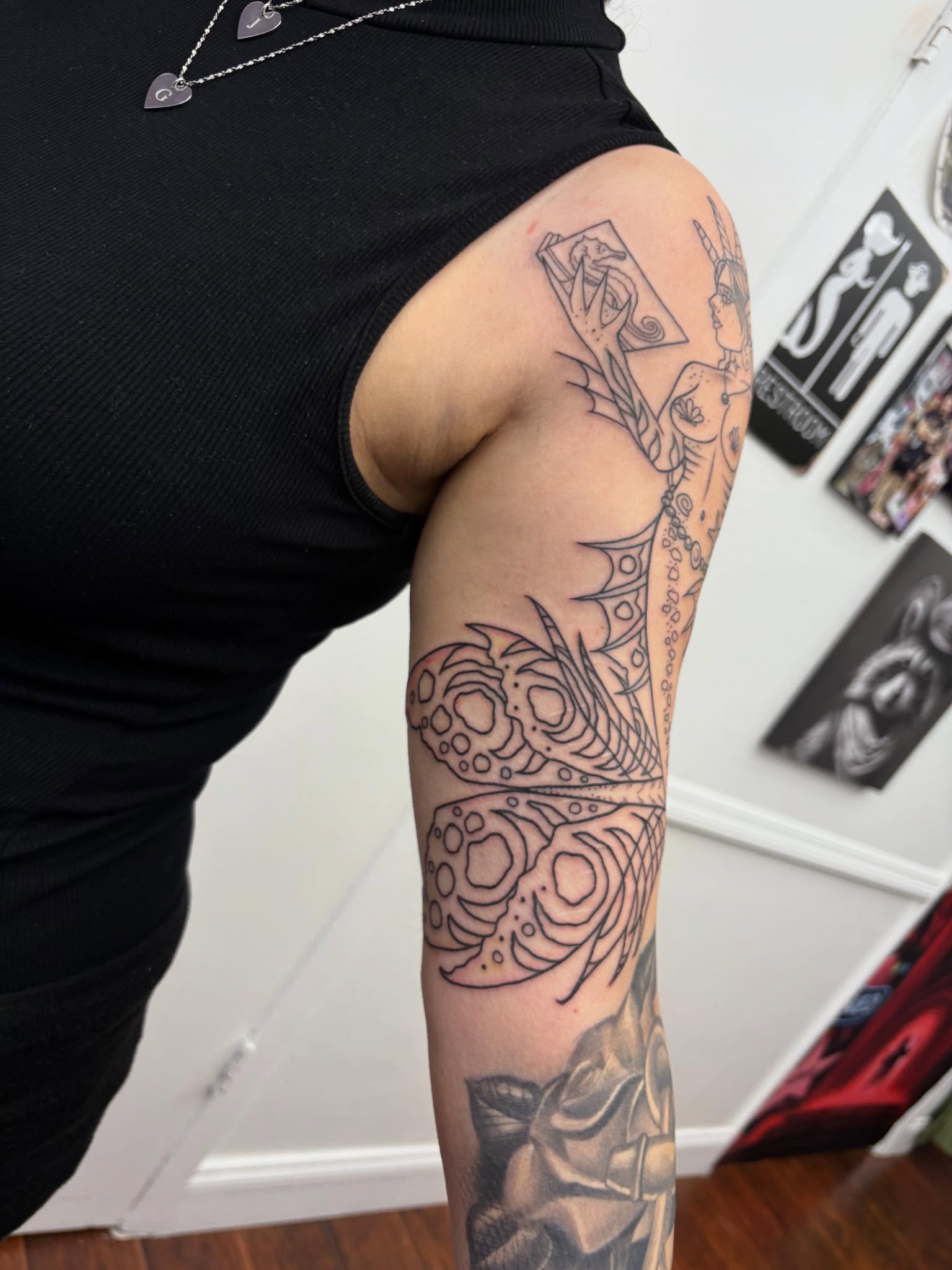 Abstract design black and grey tattoo on the forearm by Skye California