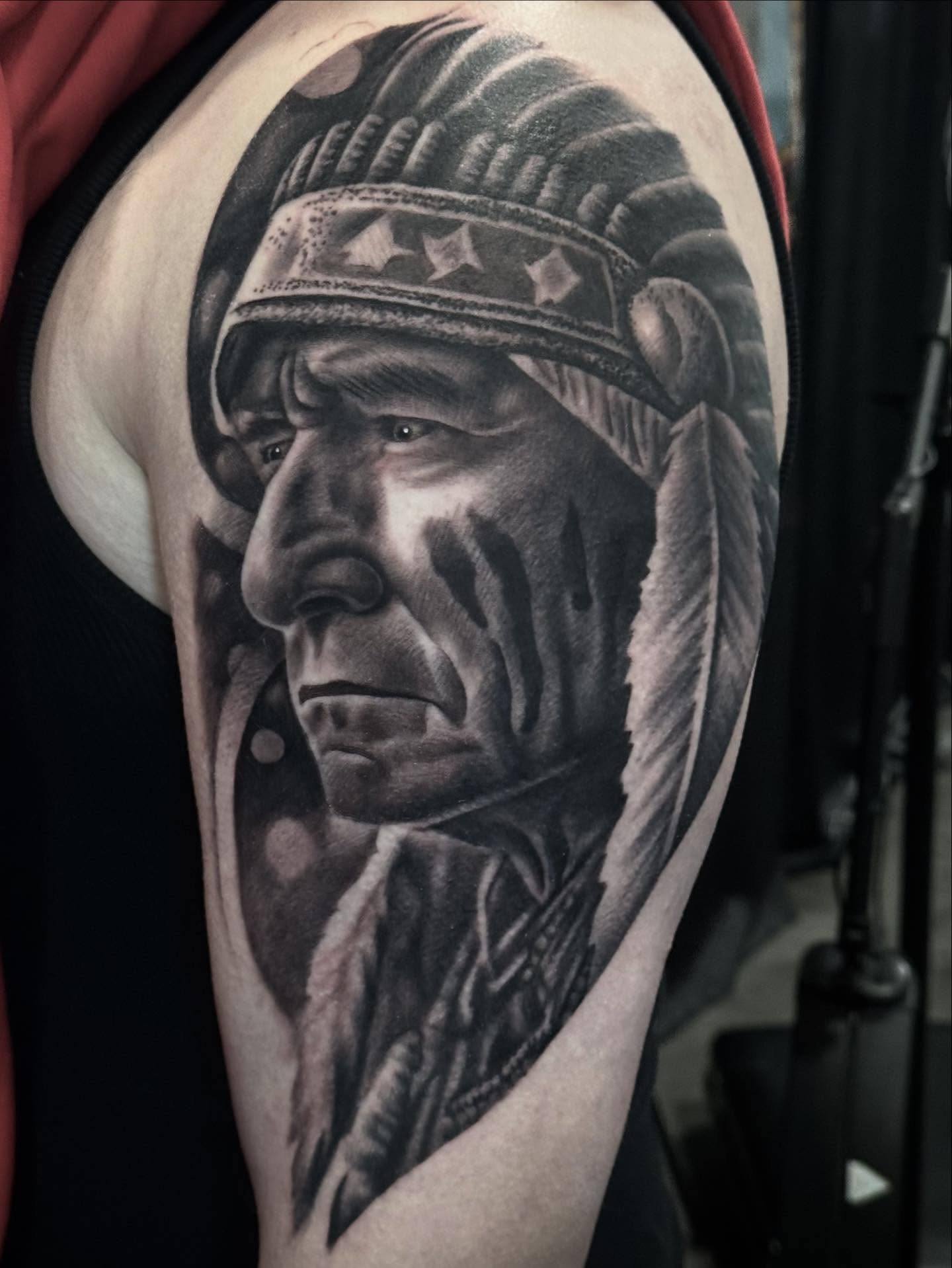 Native American chief portrait surrealism tattoo on the forearm by Tony Garcia