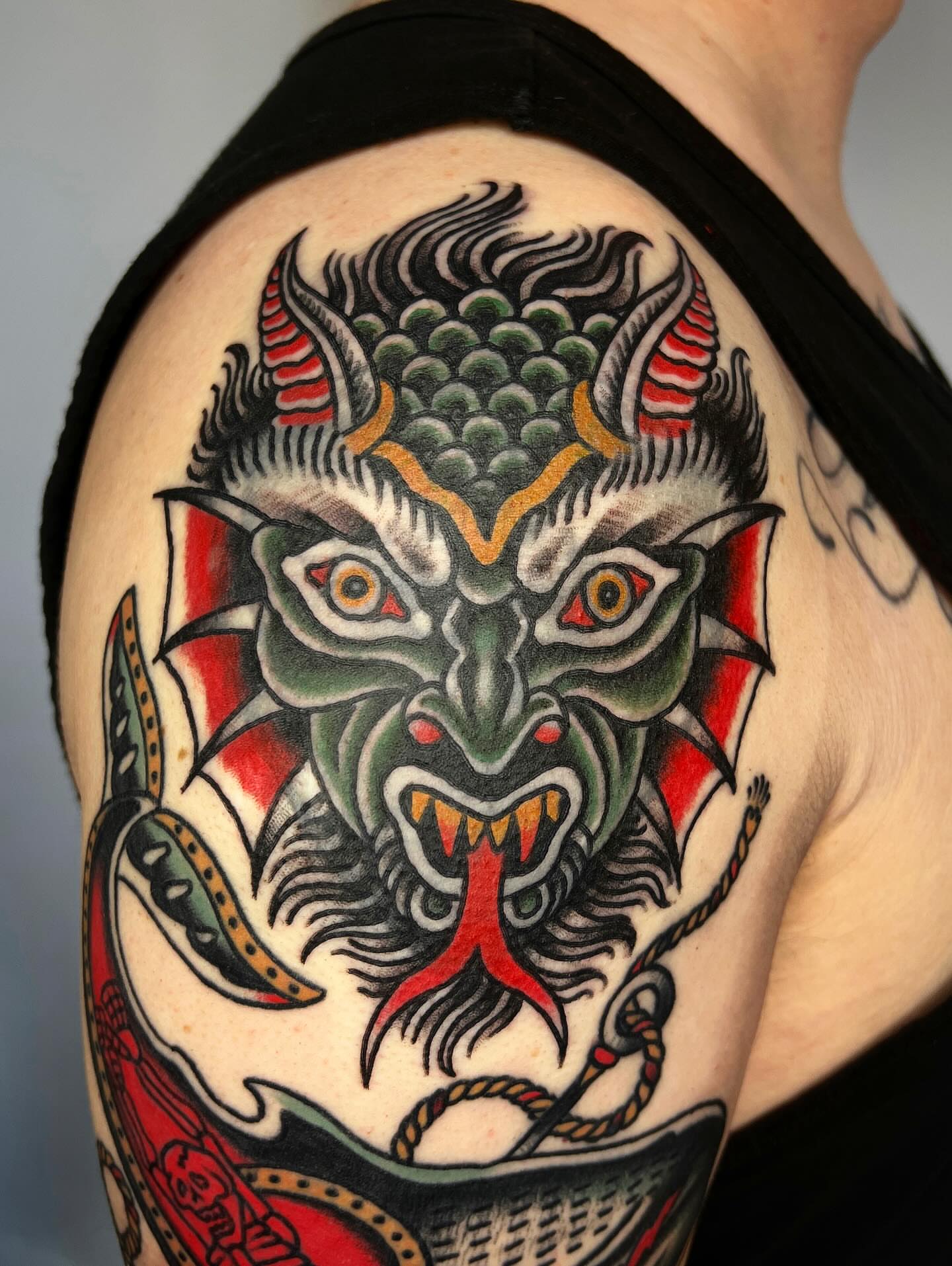 Demon mask American traditional tattoo on the shoulder by Leo 🌞 Pdx Tattoo