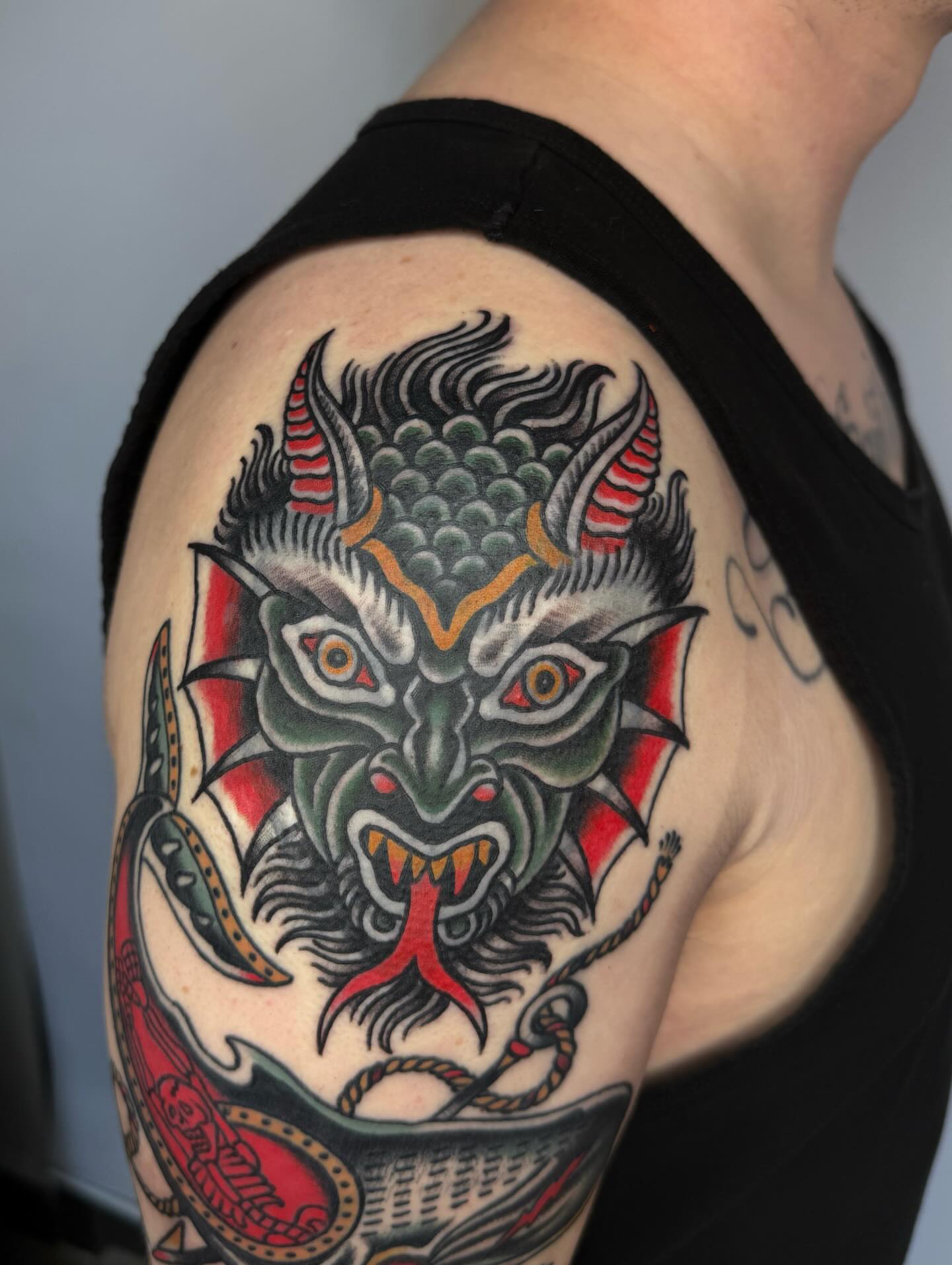Demon head American traditional tattoo on the shoulder by Leo 🌞 Pdx Tattoo