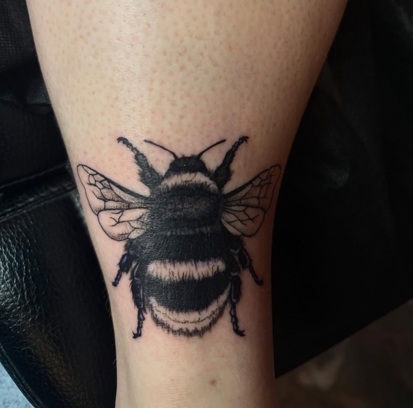 Bee black and grey tattoo on the forearm by destany aguilera, Davenport, Iowa
