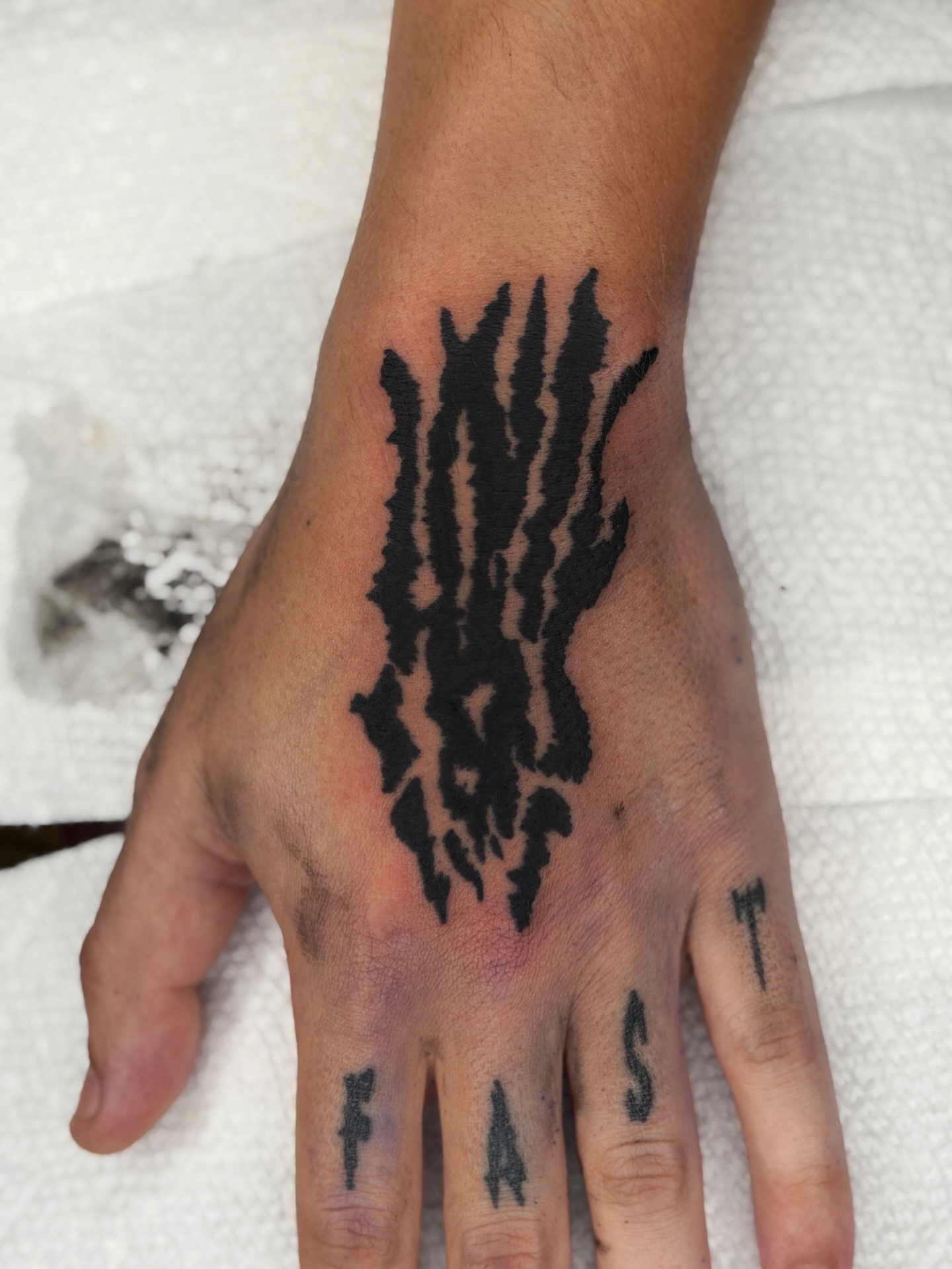 Abstract pattern black and grey tattoo on the hand by Diego Treviño